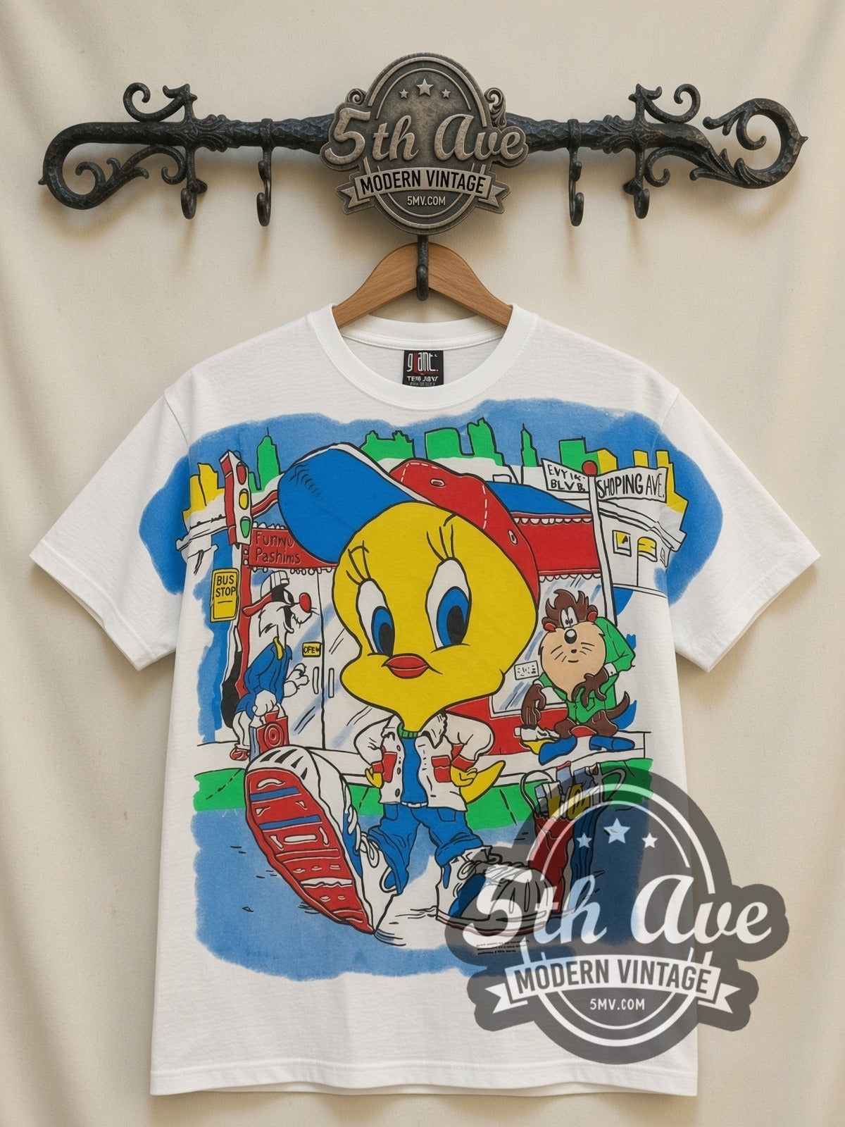 Looney Tunes Tweety Streetwear City all-over-print vintage cartoon t-shirt in white, front view on a display rack