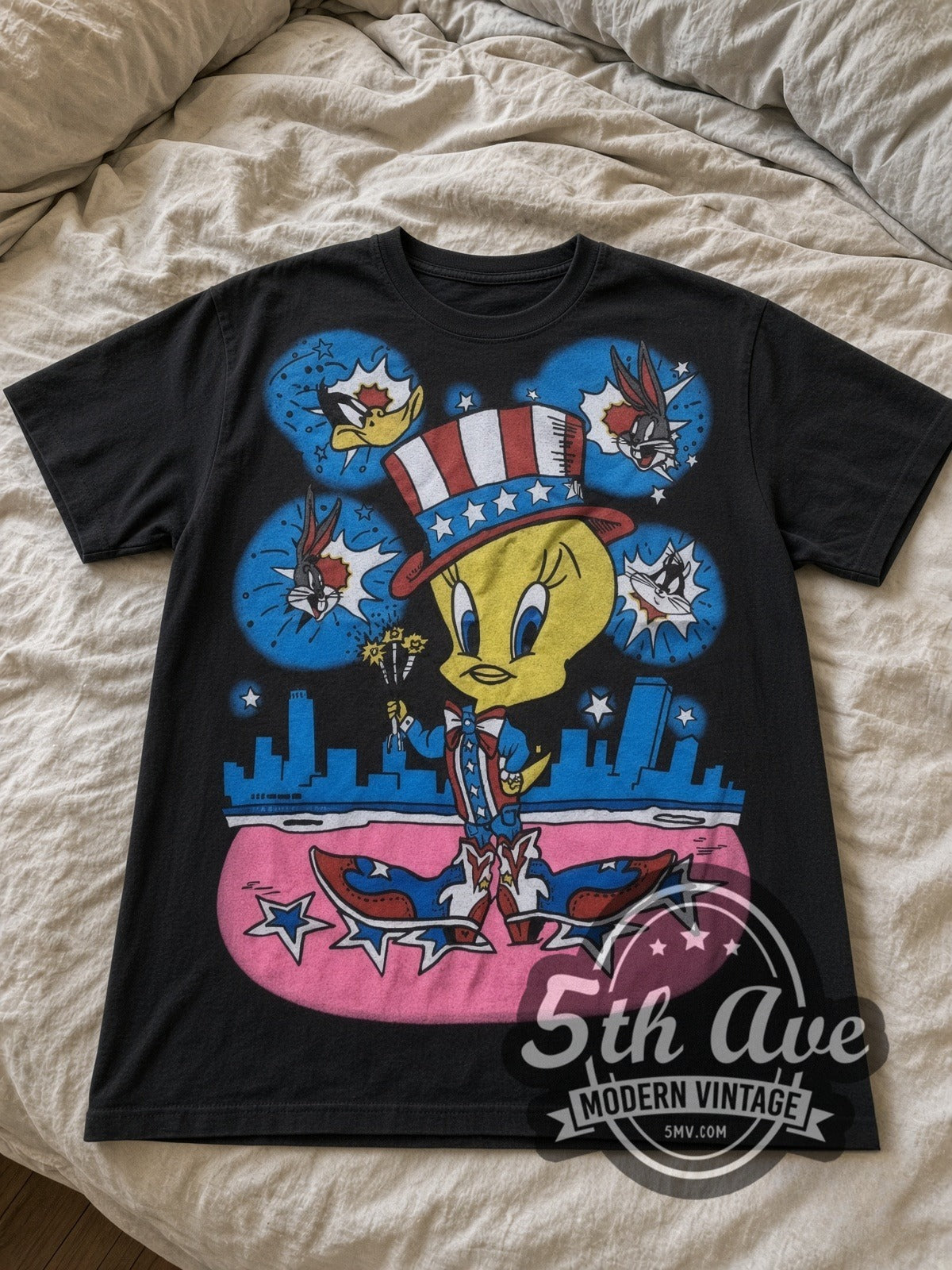 Looney Tunes Tweety Uncle Sam Patriotic all-over-print vintage cartoon tee in black laid flat