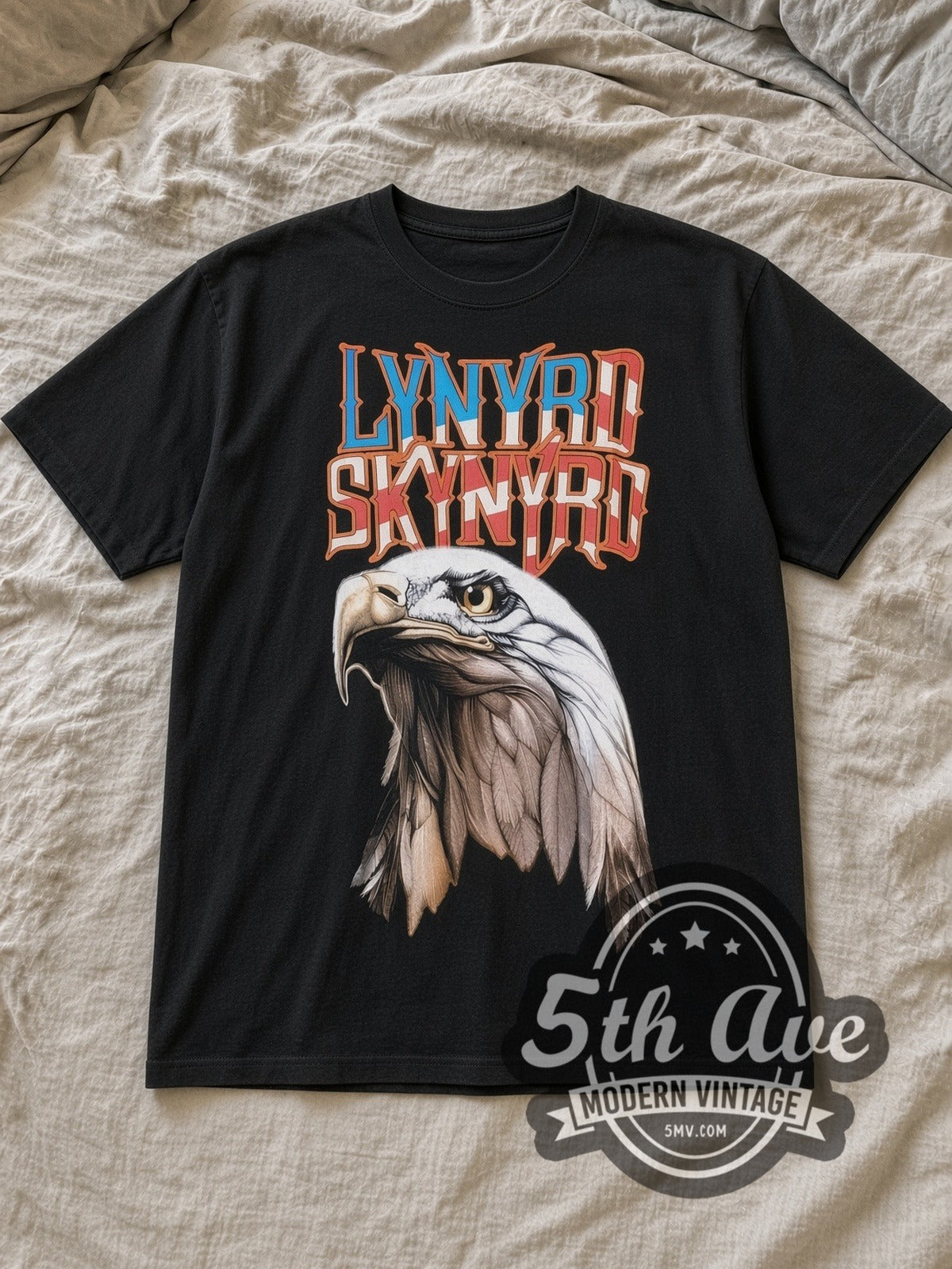Black Lynyrd Skynyrd Vintage Band T-Shirt laid flat on a linen bed