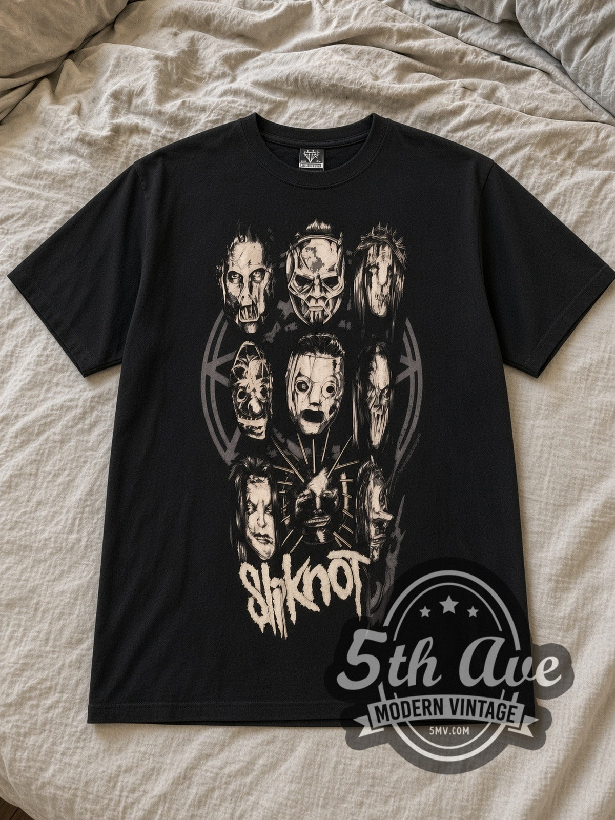 Black Slipknot Maggots Unite Vintage Band T-Shirt laid flat on a linen bed