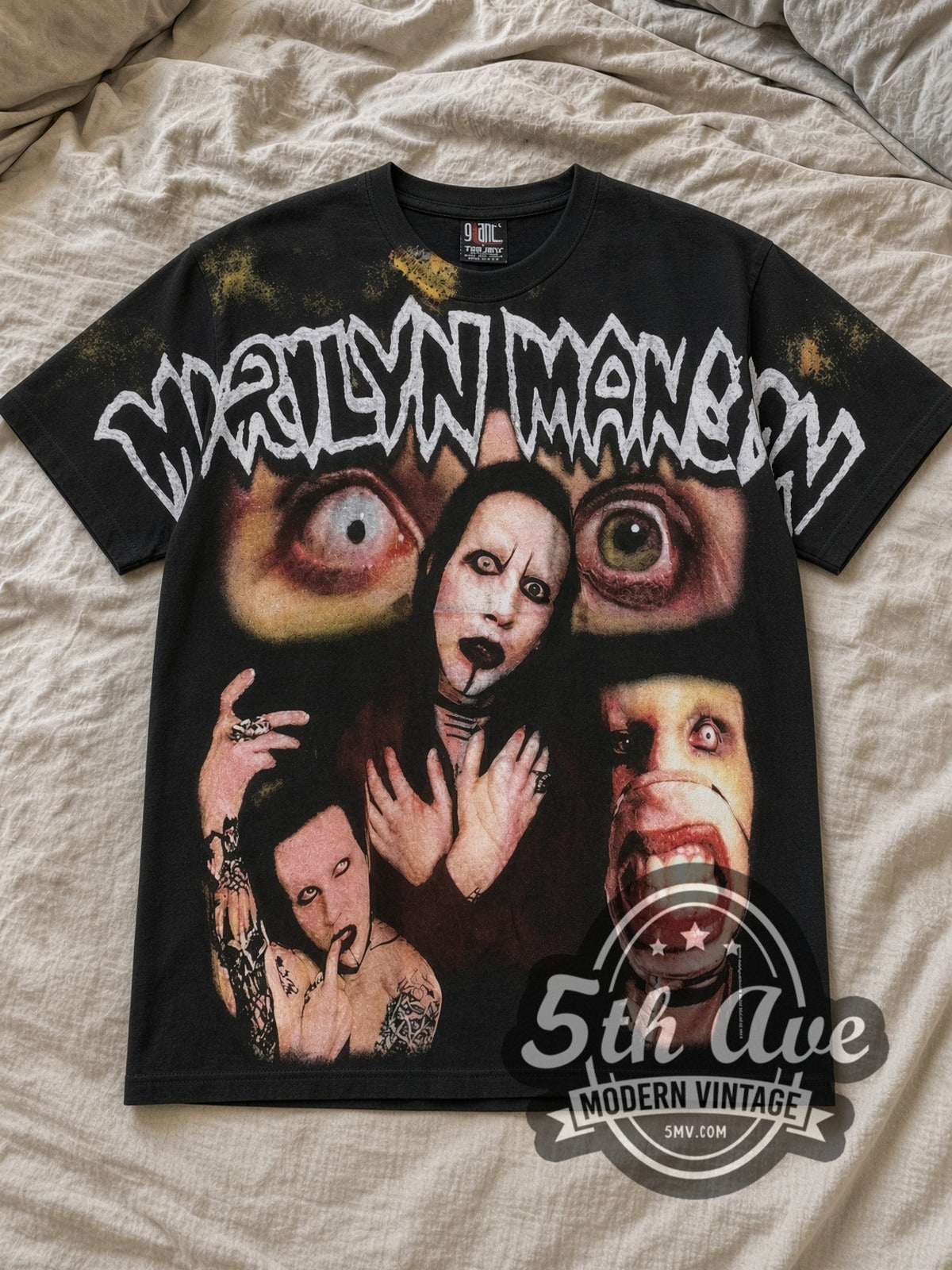 Black Marilyn Manson All Over Print Vintage Band T-Shirt laid flat on a linen bed