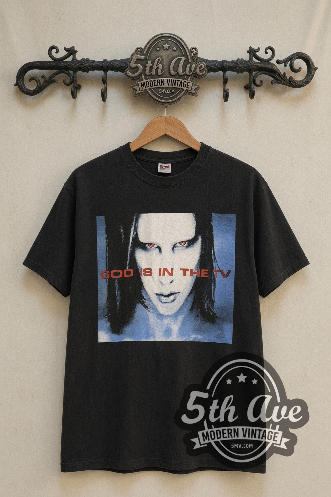 Marilyn Manson God Is in the TV Blue Face band t-shirt front on 5th Ave iron rack
