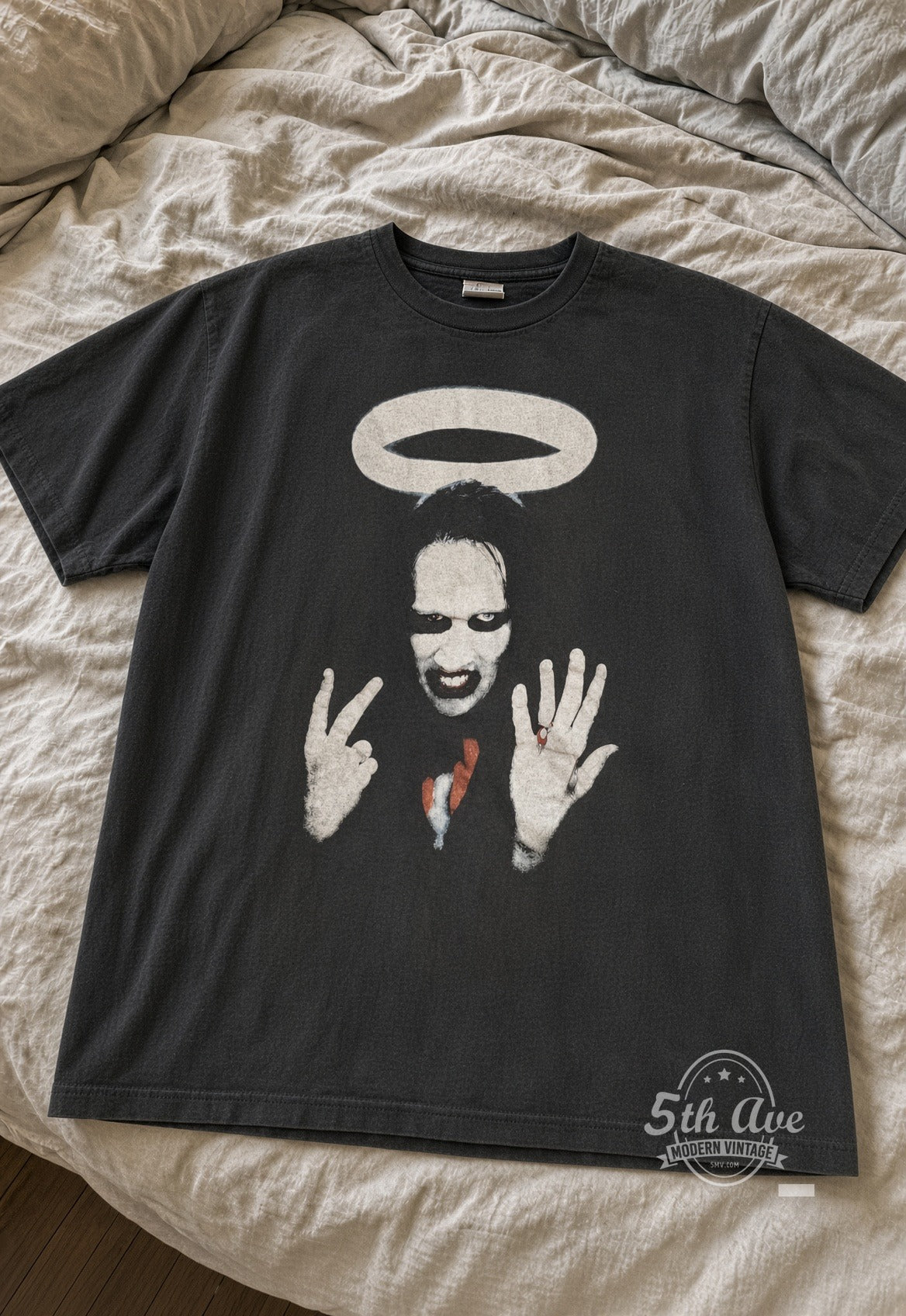 Marilyn Manson Halo Middle Fingers vintage tee laid flat on bed