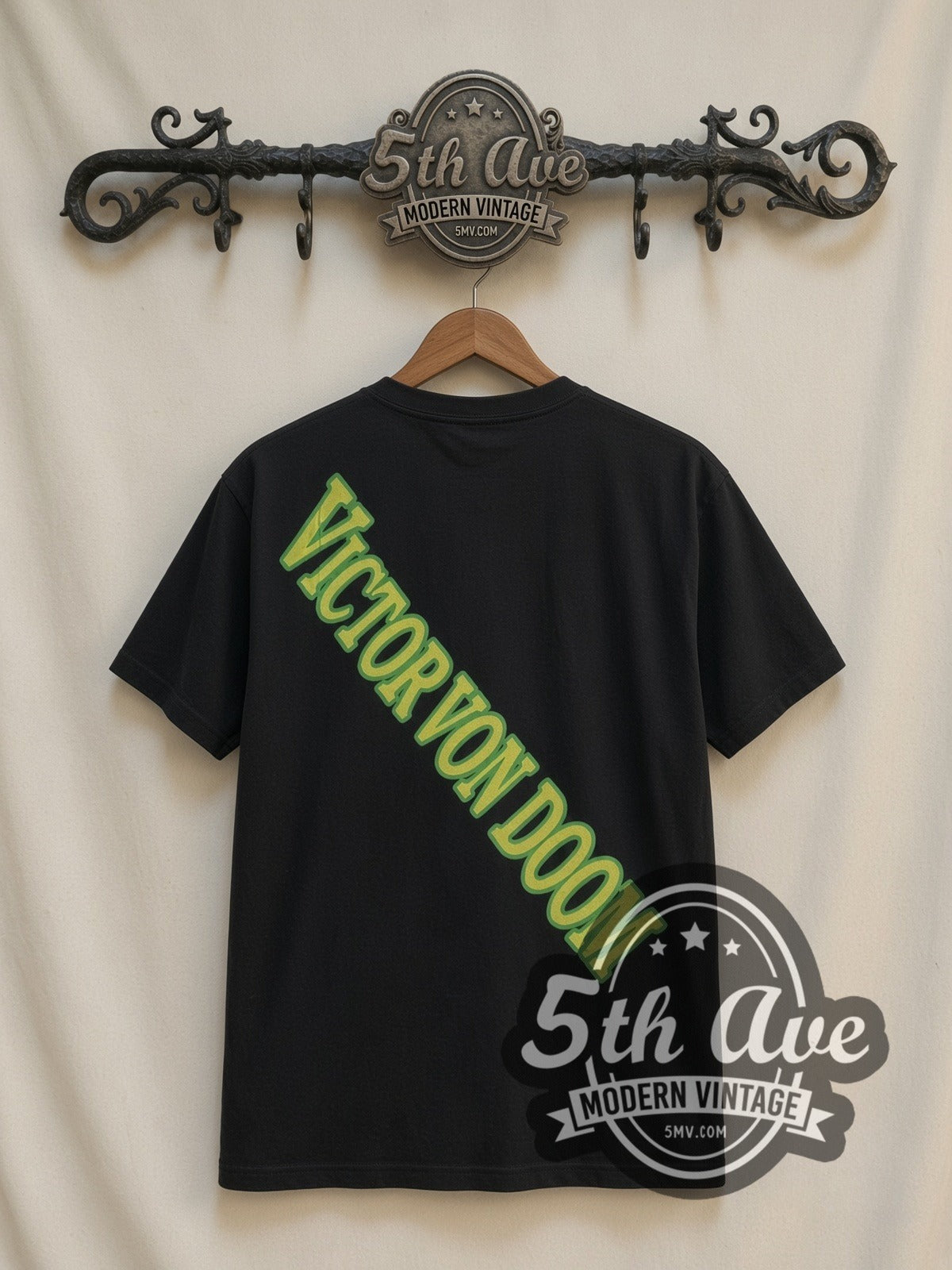 Marvel Dr. Doom Castle Energy all-over-print vintage cartoon t-shirt in black, back view on a display rack