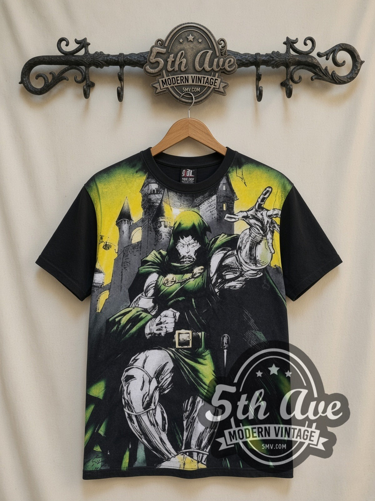 Marvel Dr. Doom Castle Energy all-over-print vintage cartoon t-shirt in black, front view on a display rack