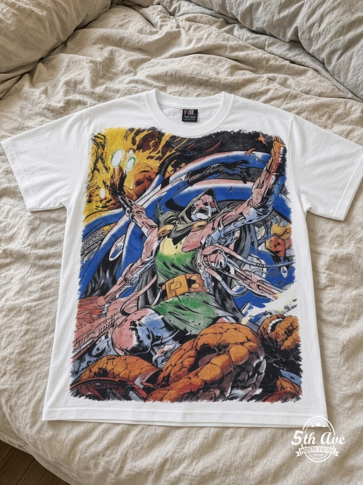 Marvel Dr Doom Cosmic Battle vintage tee laid on bed