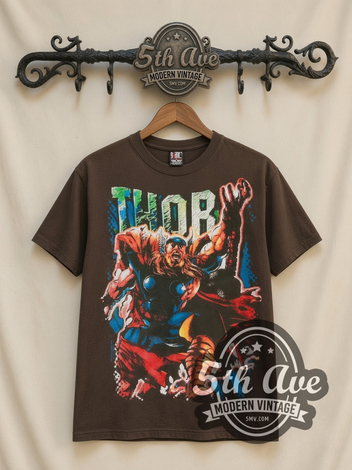 Marvel Thor Comic Action all-over-print vintage cartoon t-shirt in brown, front view on a display rack