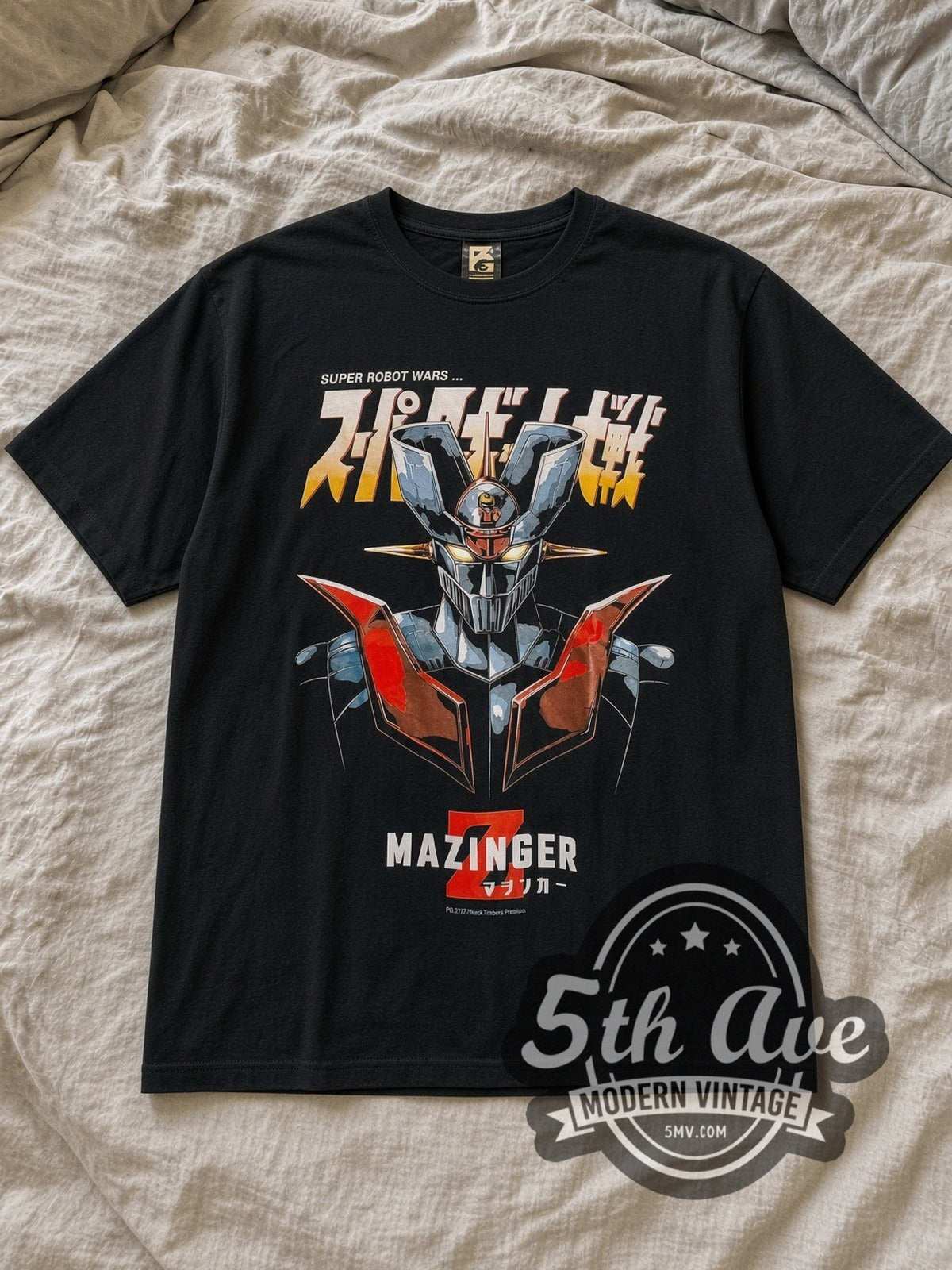Black Mazinger Z Vintage Anime T-Shirt laid flat on a linen bed