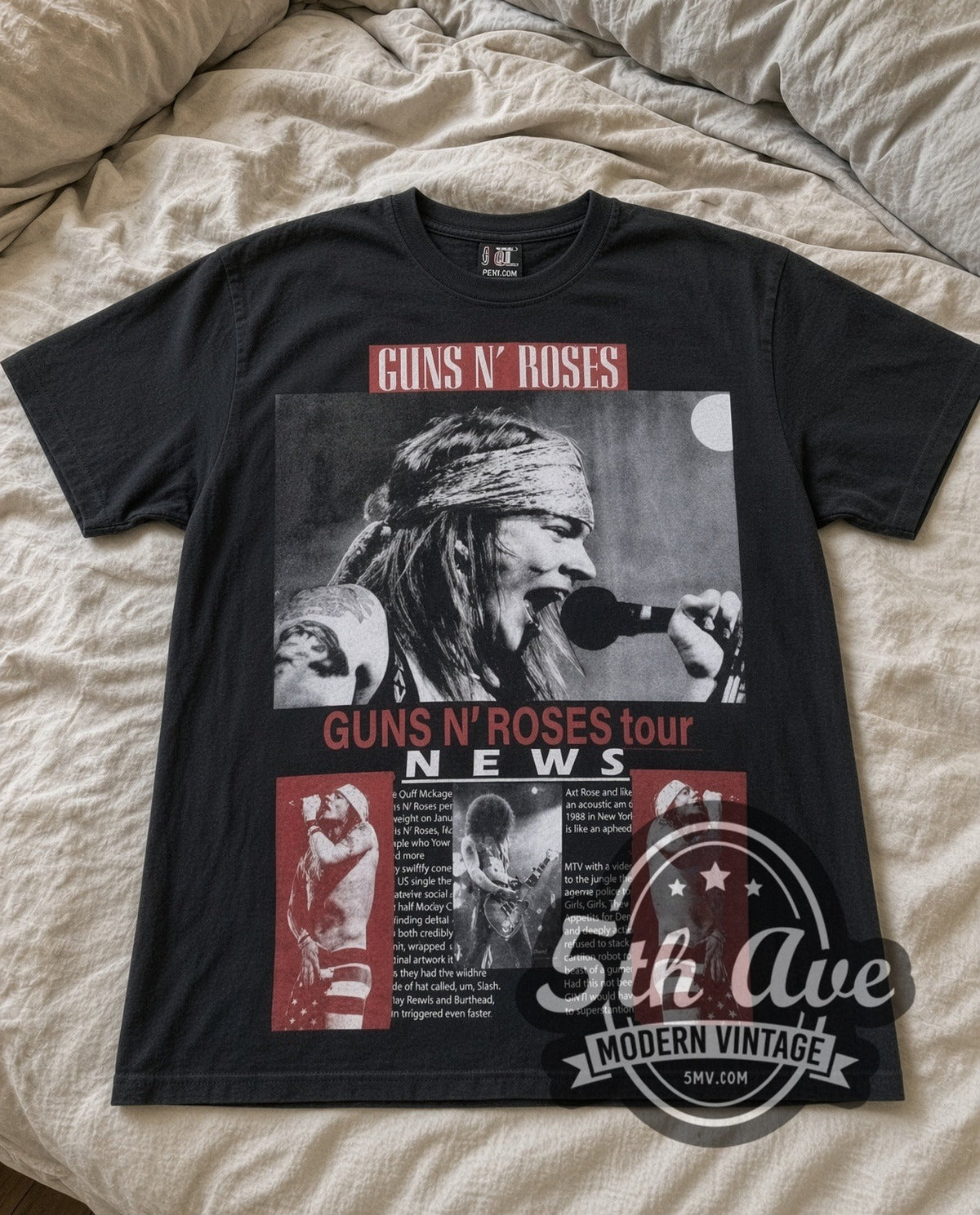 Guns N Roses Tour NEWS vintage band t-shirt in black laid flat on a bed, front artwork