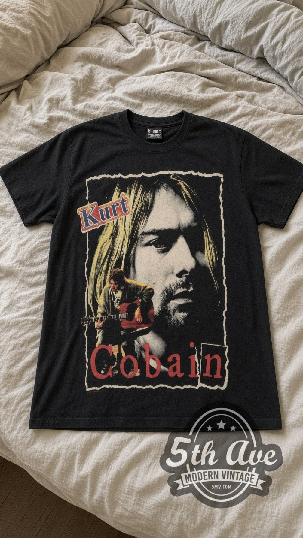 Kurt Cobain Portrait vintage band t-shirt in black laid flat on a bed, front artwork
