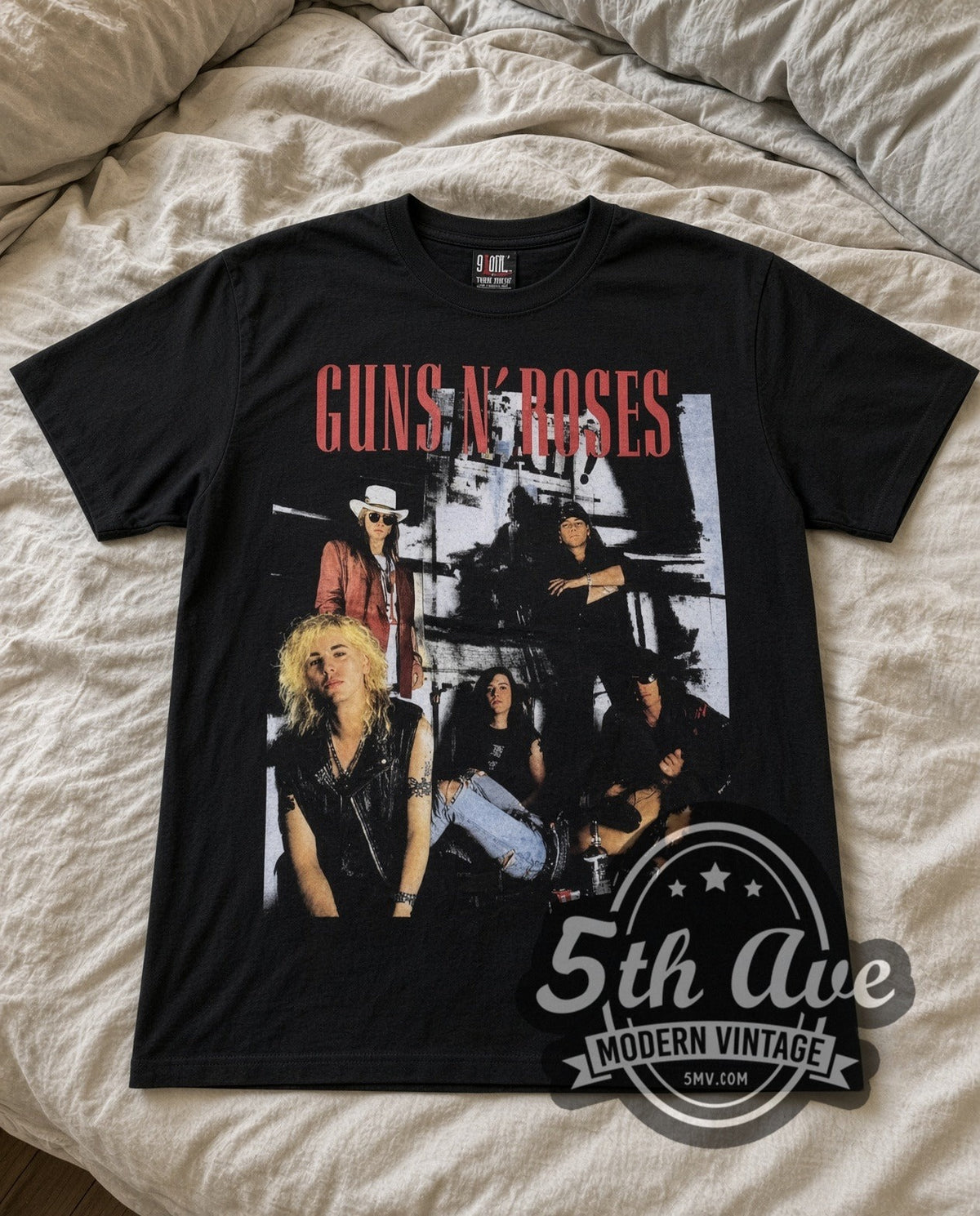 Guns N Roses Band Photo vintage band t-shirt in black laid flat on a bed, front artwork