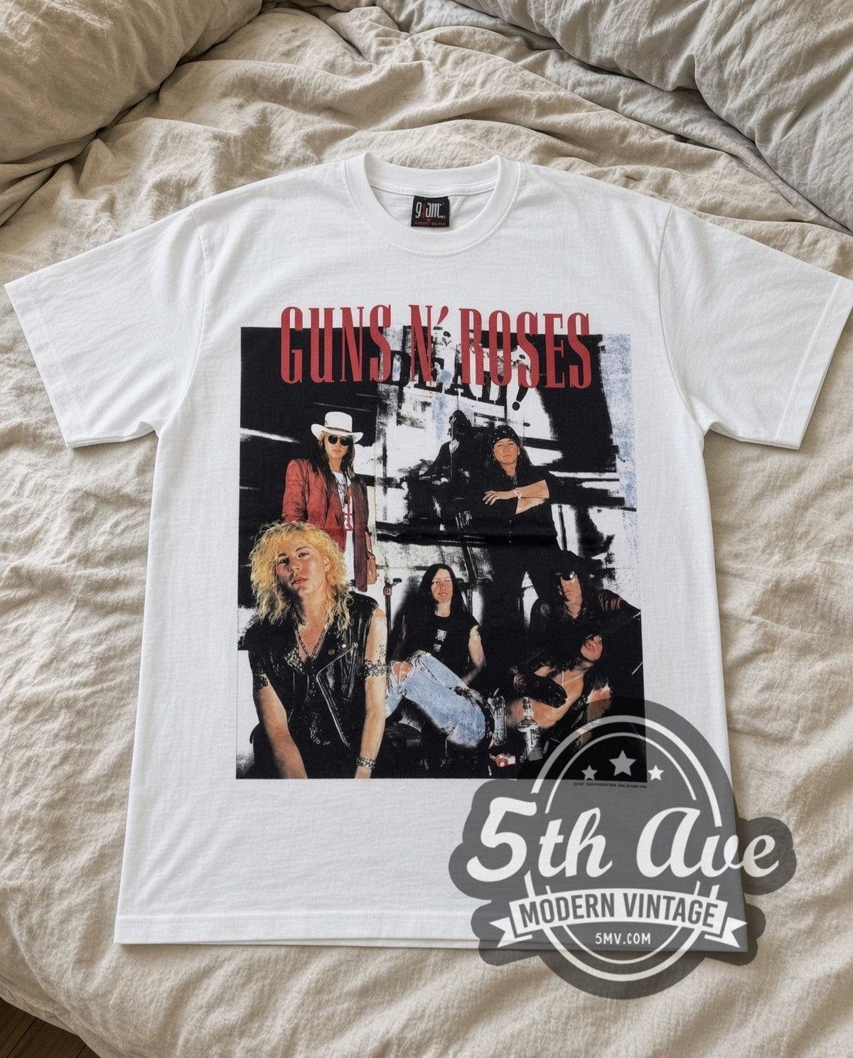 Guns N Roses Band Photo vintage band t-shirt in white laid flat on a bed, front artwork