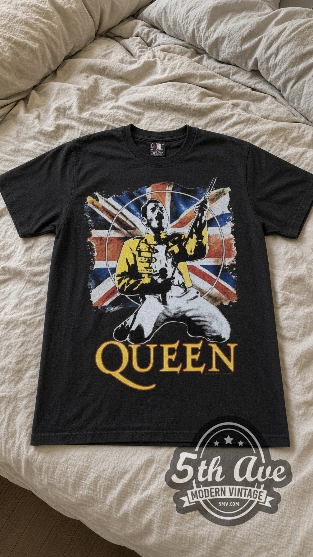 Queen Freddie Union Jack vintage band t-shirt in black laid flat on a bed, front artwork