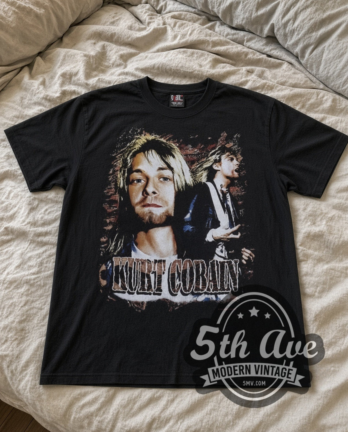 Kurt Cobain With Band vintage band t-shirt in black laid flat on a bed, front artwork