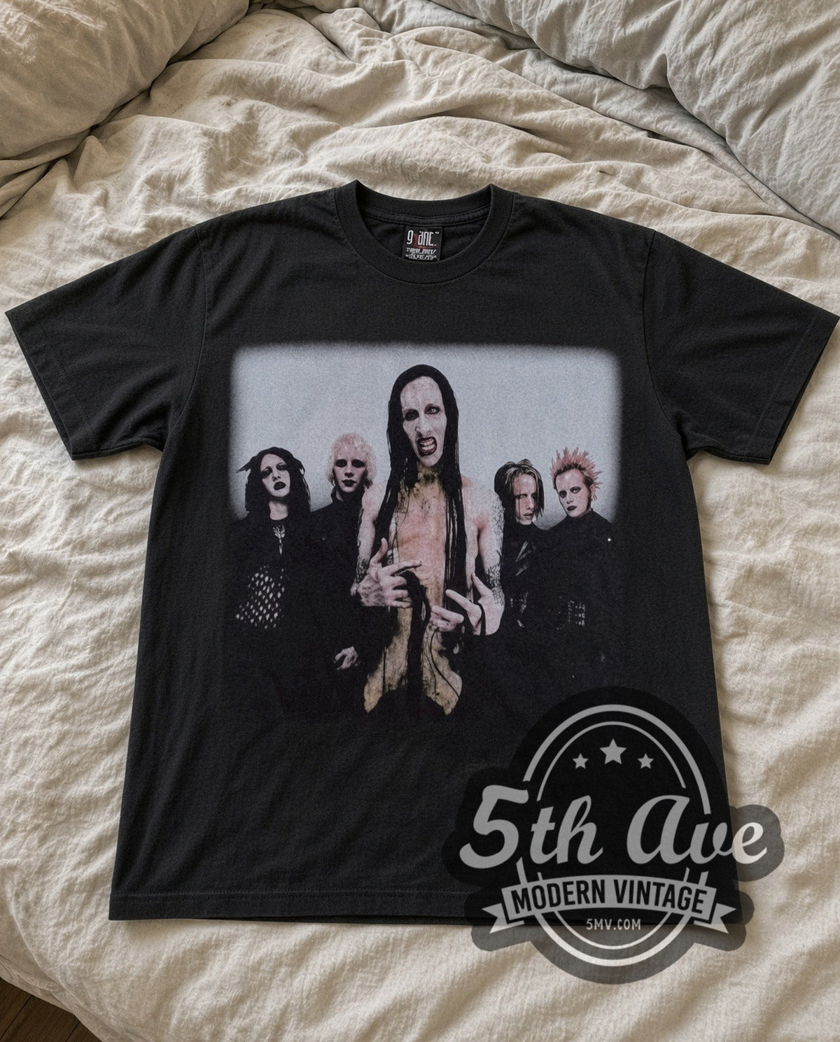 Marilyn Manson Band Photo vintage band t-shirt laid flat on a bed, front artwork