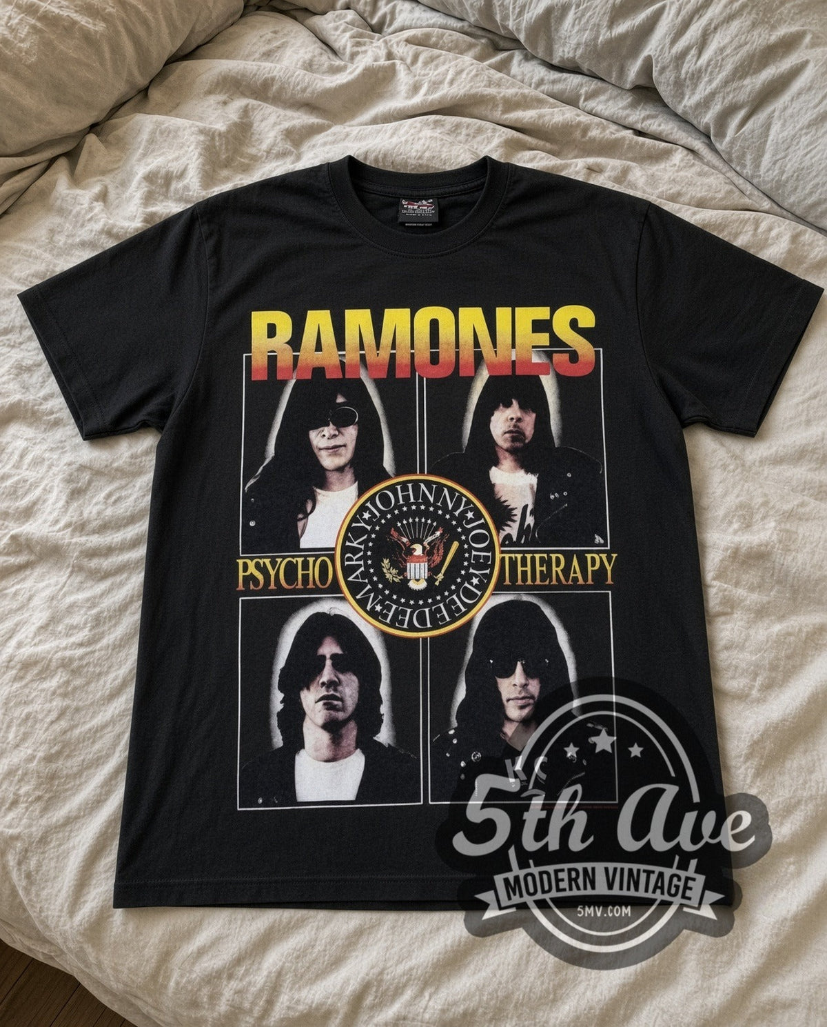 Ramones Psycho Therapy vintage band t-shirt in black laid flat on a bed, front artwork