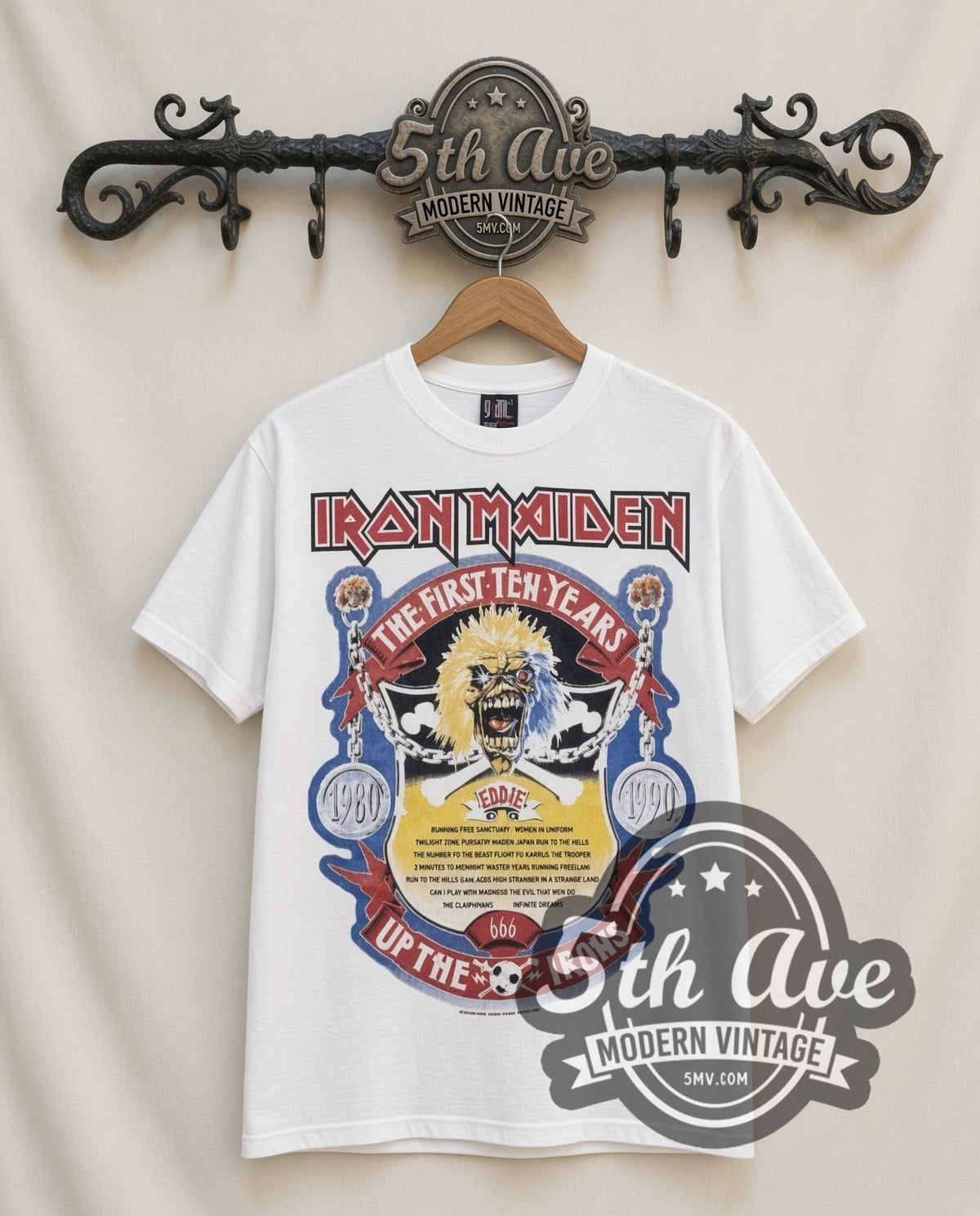 Iron Maiden First Ten Years vintage band t-shirt in white, front view on a display rack