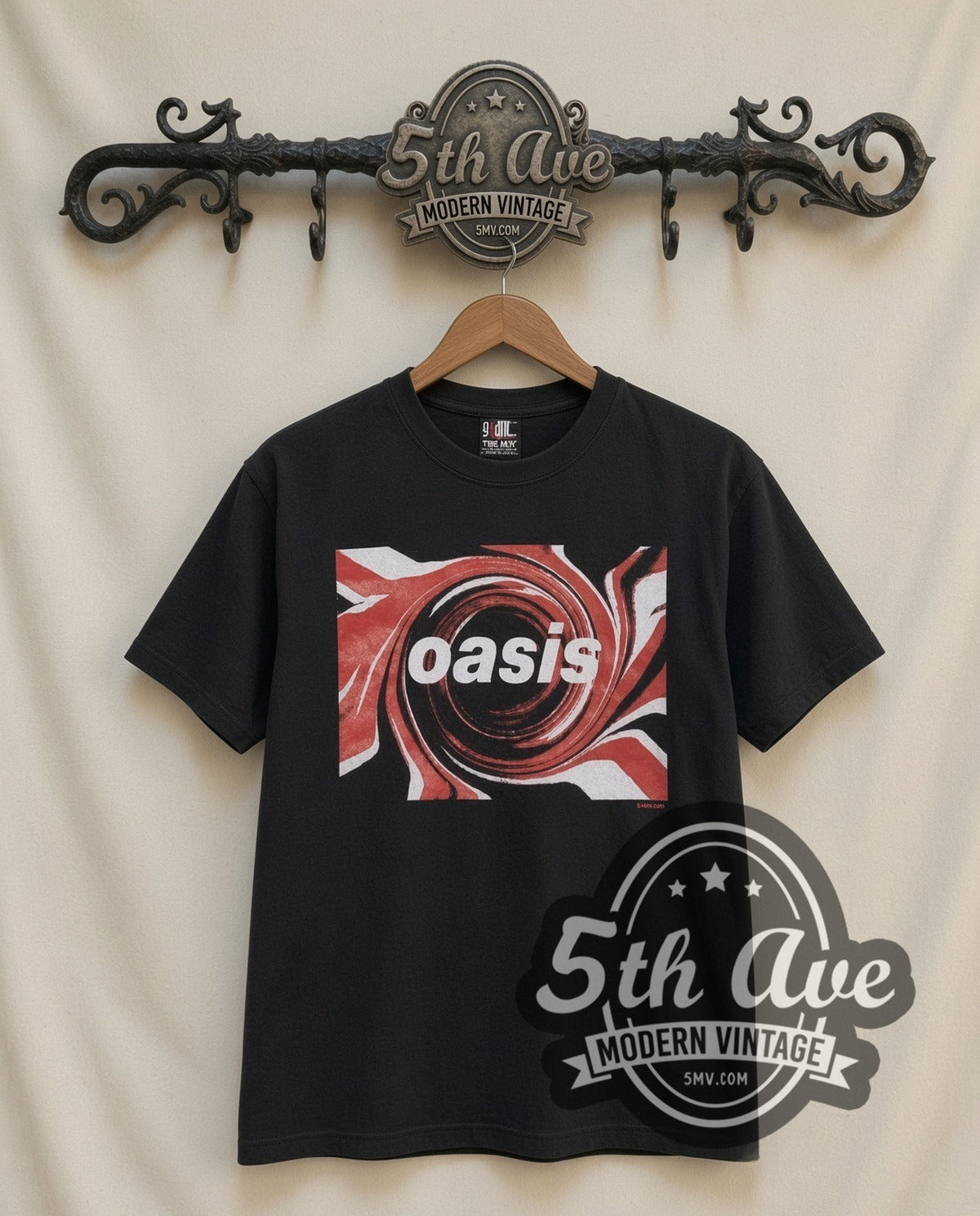 Oasis Swirl Logo vintage band t-shirt in black, front view on a display rack