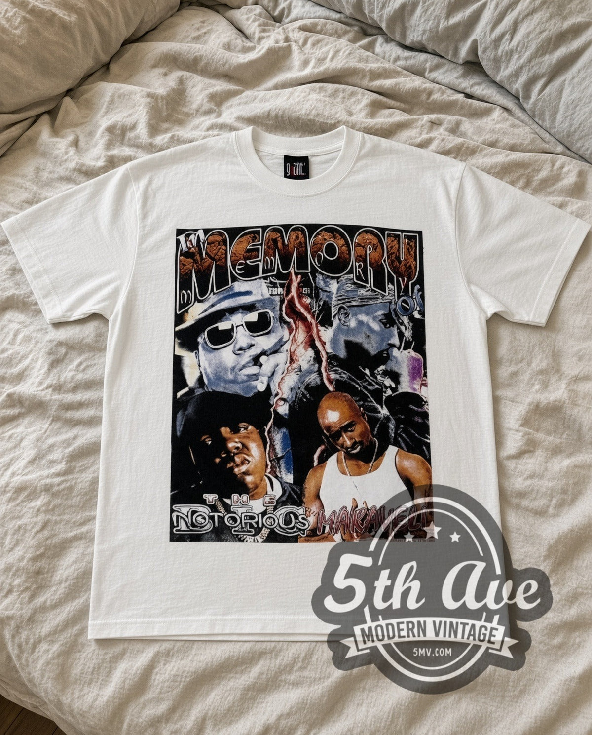 The Notorious B.I.G. & Makaveli In Memory Of vintage rap tee in white laid flat on a bed, front artwork