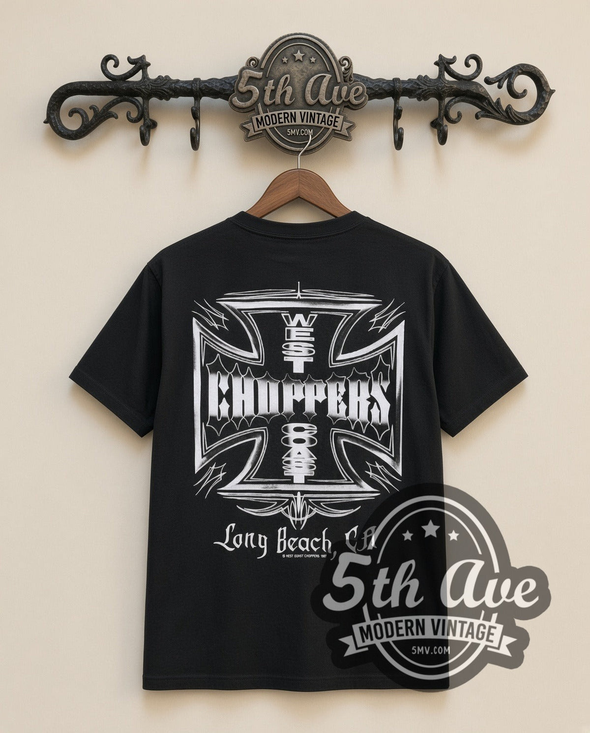 West Coast Choppers Iron Cross Vintage Motorsports graphic tee, back view on a display rack