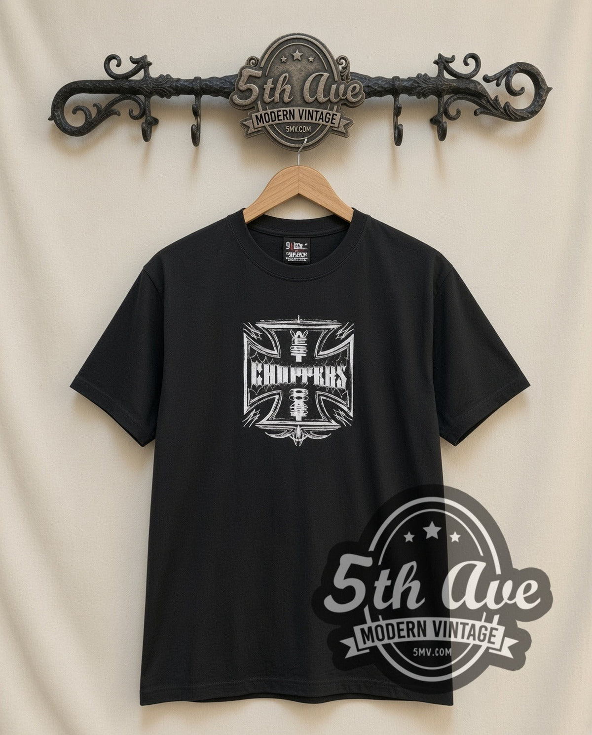 West Coast Choppers Iron Cross Vintage Motorsports graphic tee, front view on a display rack