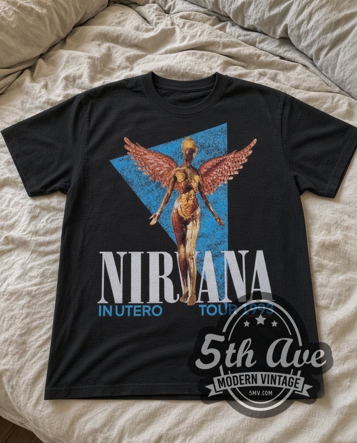 Nirvana In Utero Angel 1993 vintage band t-shirt in black laid flat on a bed, front artwork