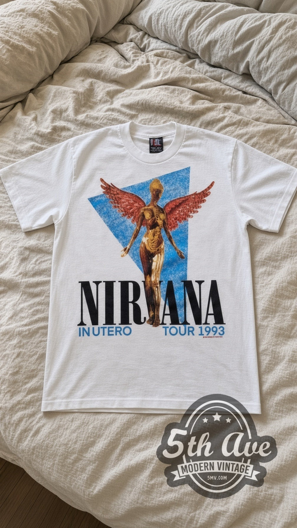 Nirvana In Utero Angel 1993 vintage band t-shirt in white laid flat on a bed, front artwork