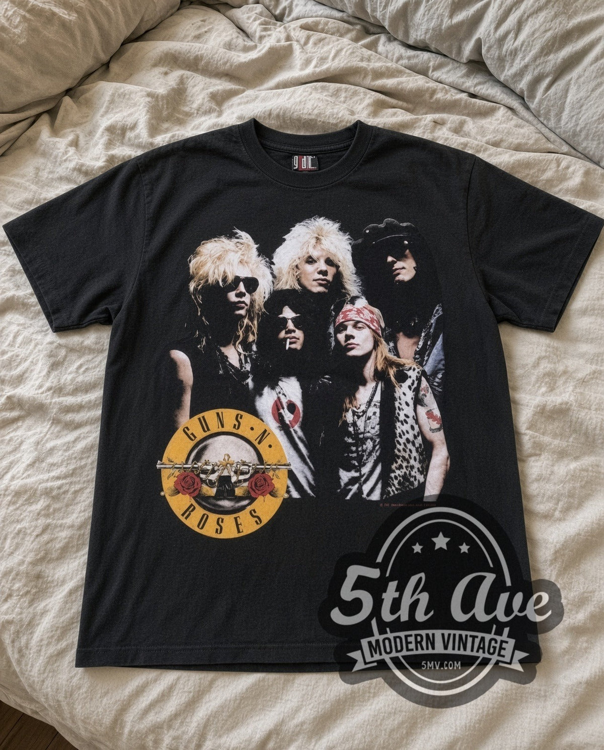 Guns N Roses Appetite Group vintage band t-shirt in black laid flat on a bed, front artwork