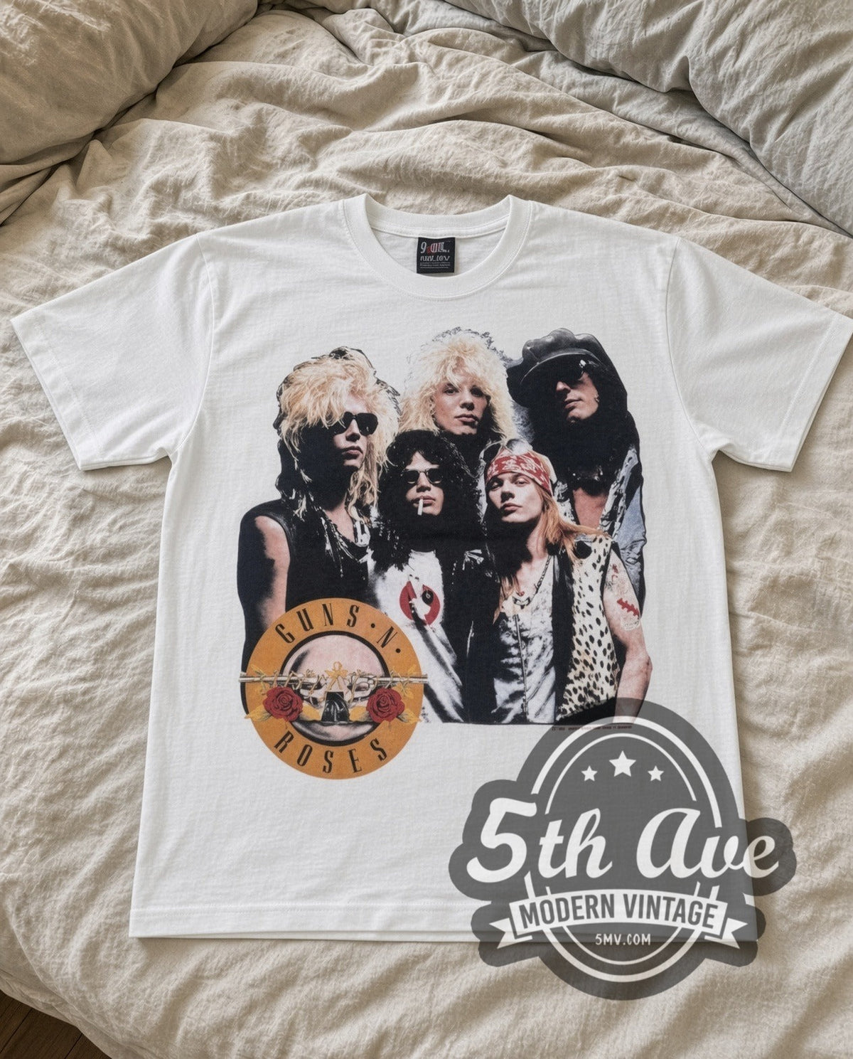 Guns N Roses Appetite Group vintage band t-shirt in white laid flat on a bed, front artwork