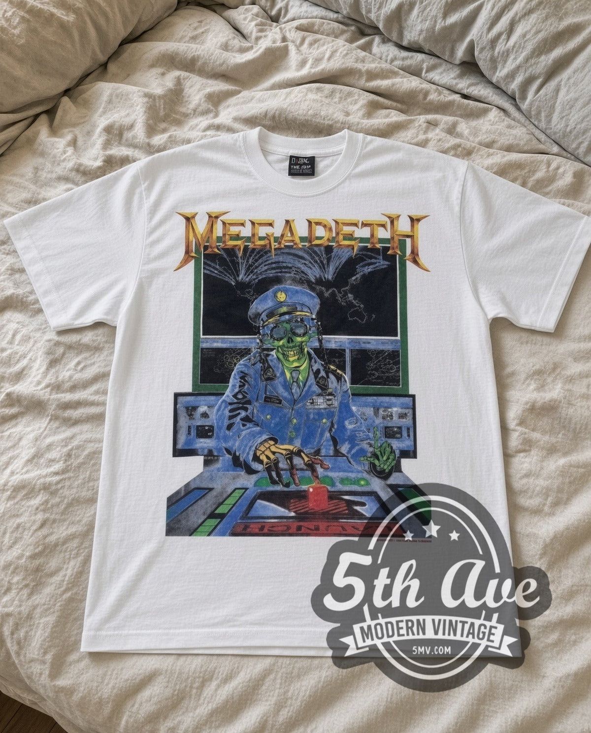 Megadeth Rust in Peace vintage band t-shirt in white laid flat on a bed, front artwork