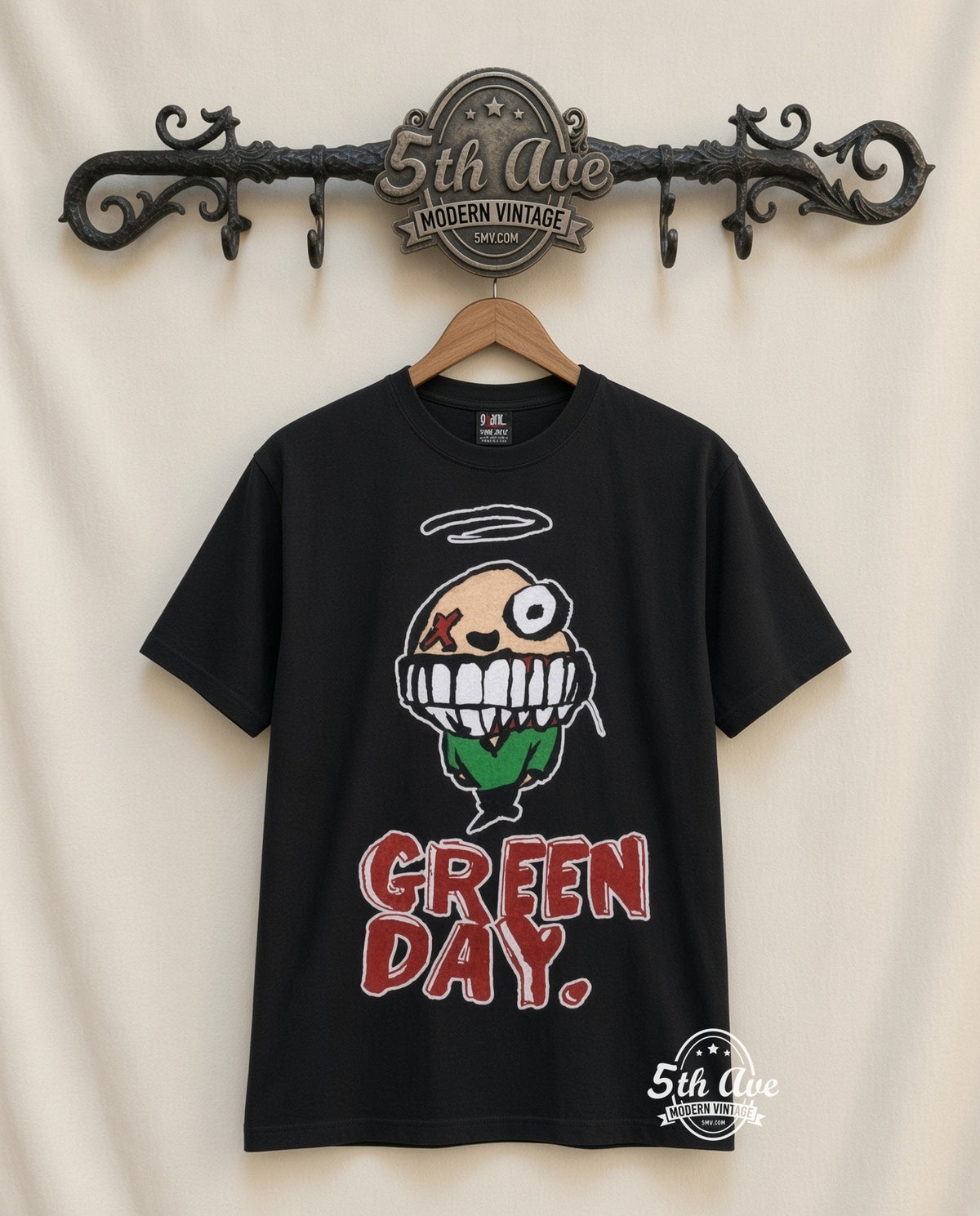 Green Day Smiley vintage band t-shirt in black, front view on a display rack