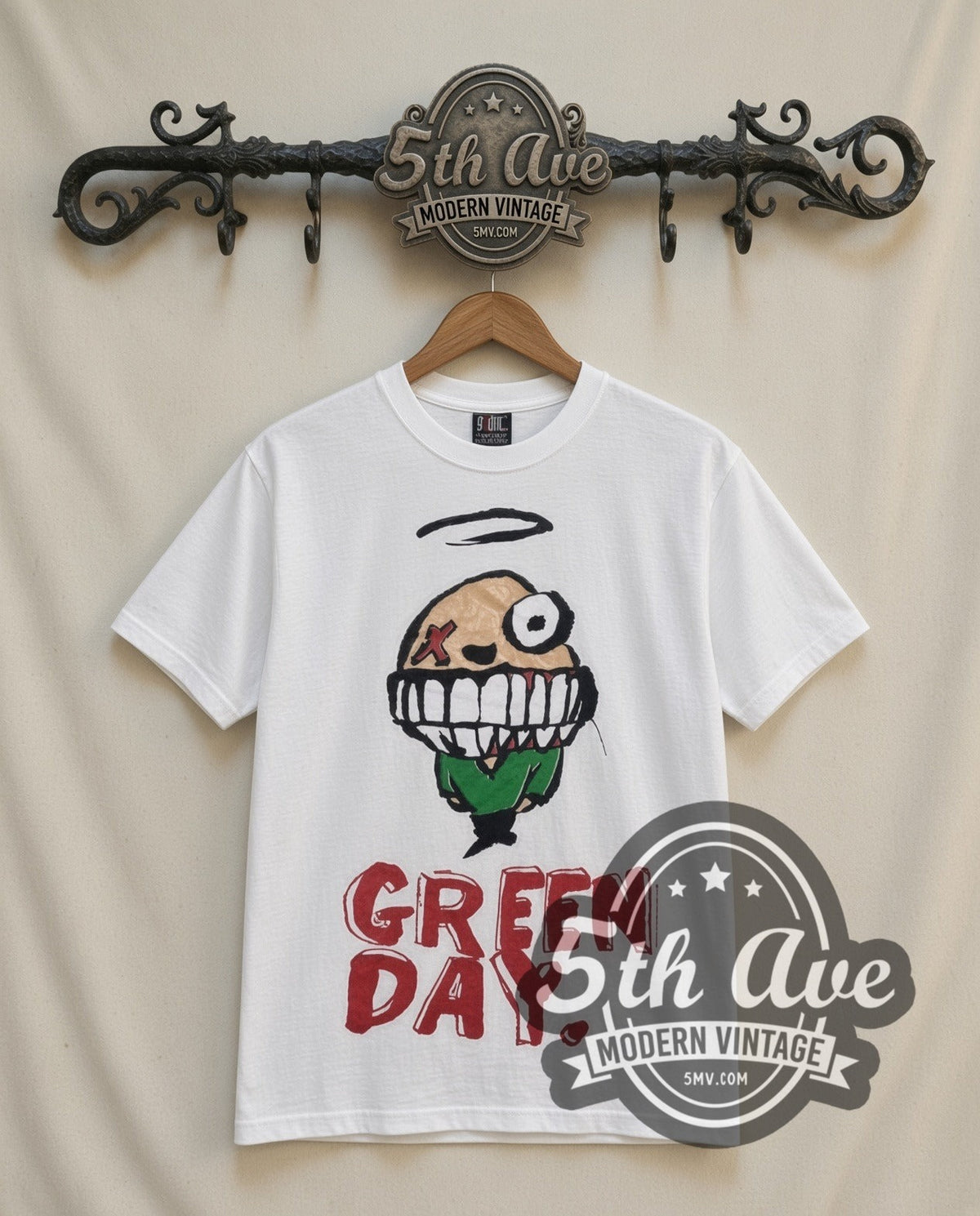 Green Day Smiley vintage band t-shirt in white, front view on a display rack