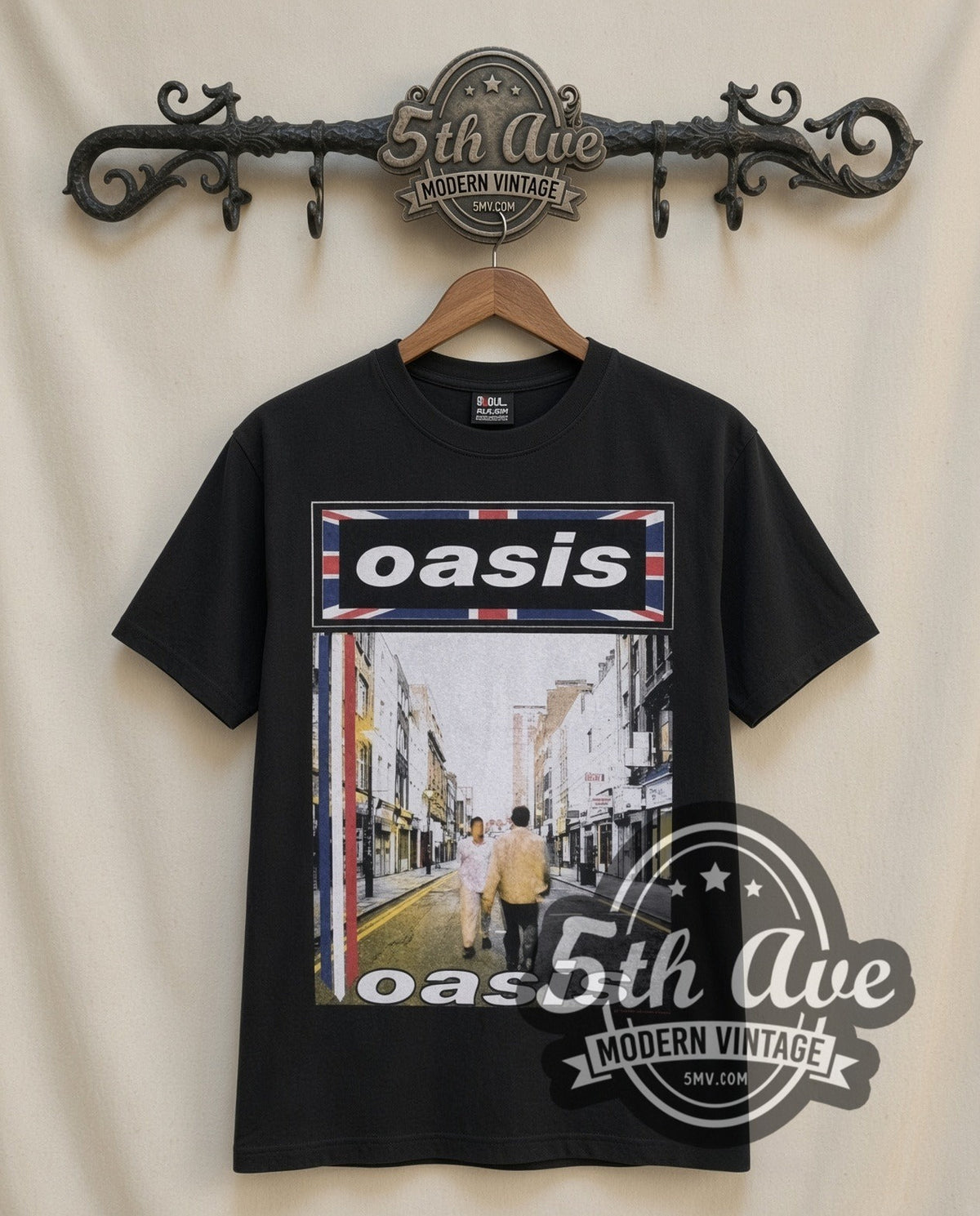 Oasis Street vintage band t-shirt in black, front view on a display rack