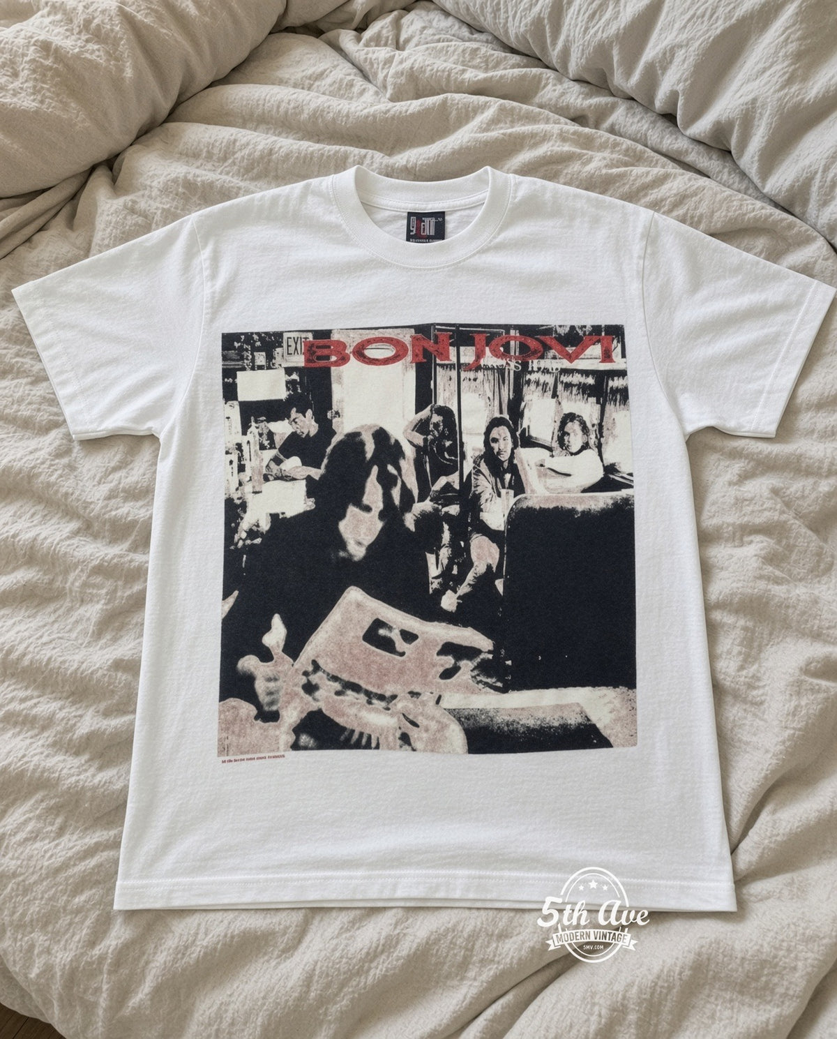 Bon Jovi Live vintage band t-shirt in white laid flat on a bed, front artwork