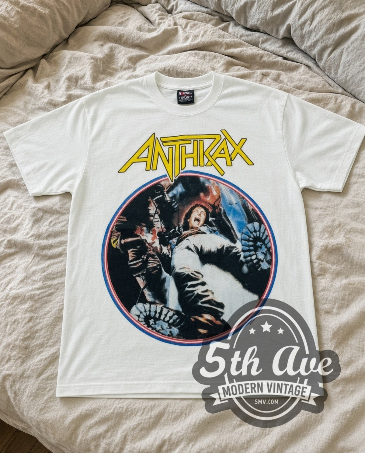 Anthrax Fist vintage band t-shirt in white laid flat on a bed, front artwork