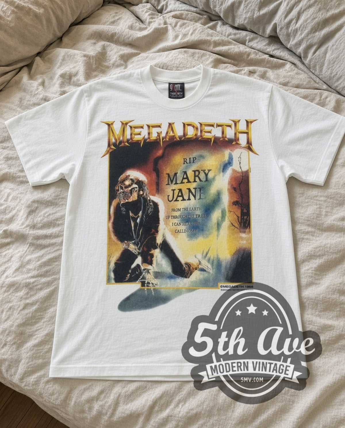 Megadeth Mary Jane vintage band t-shirt in white laid flat on a bed, front artwork