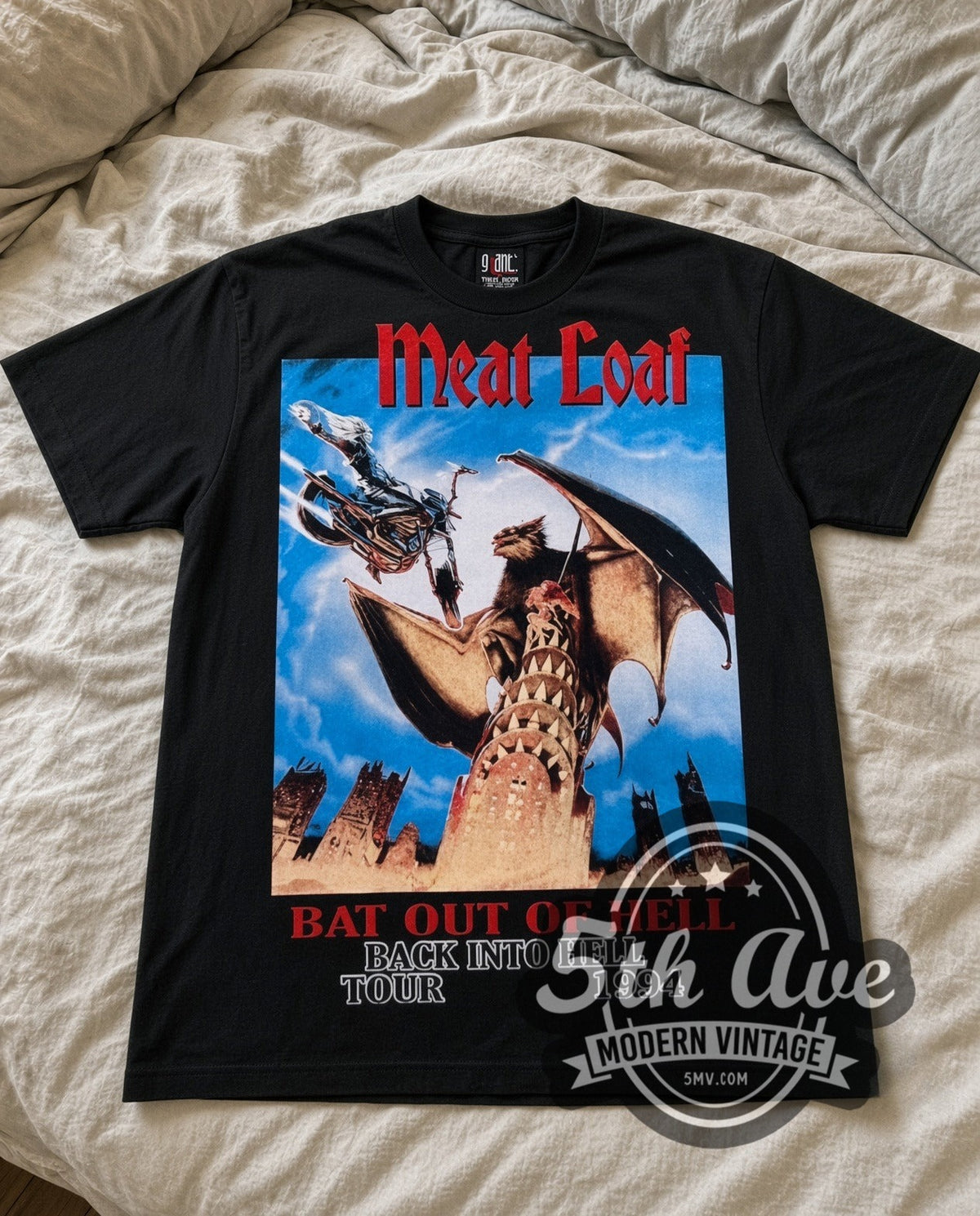 Meat Loaf Bat Out of Hell 1994 vintage band t-shirt in black laid flat on a bed, front artwork