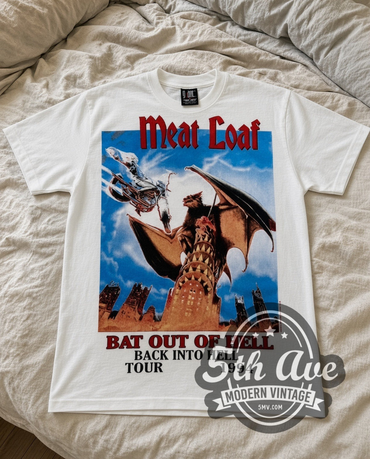 Meat Loaf Bat Out of Hell 1994 vintage band t-shirt in white laid flat on a bed, front artwork