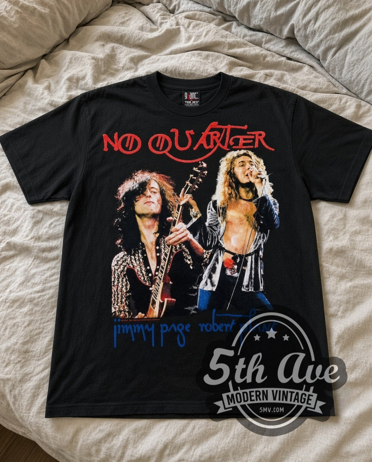 Jimmy Page No Quarter vintage band t-shirt in black laid flat on a bed, front artwork