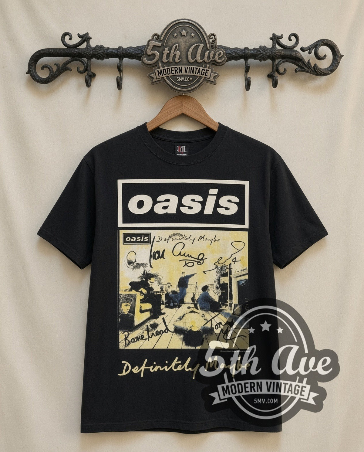 Oasis Definitely Maybe vintage band t-shirt in black, front view on a display rack