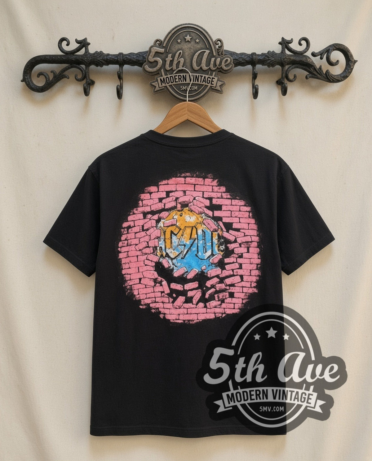 AC/DC Cannon vintage band t-shirt in black, back view on a display rack