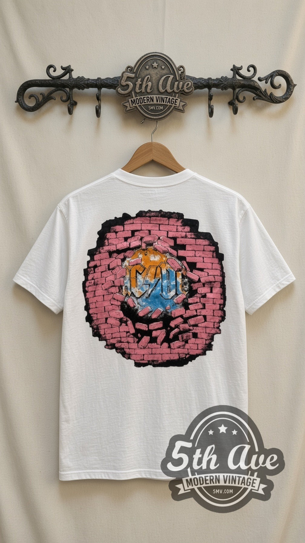 AC/DC Cannon vintage band t-shirt in white, back view on a display rack