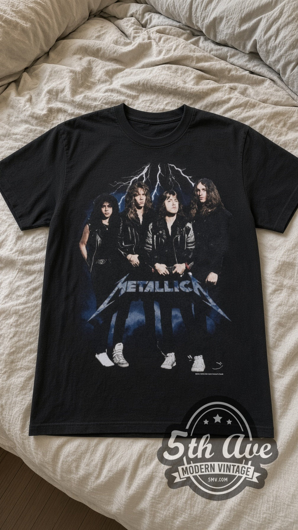 Metallica Group Photo vintage band t-shirt in black laid flat on a bed, front artwork
