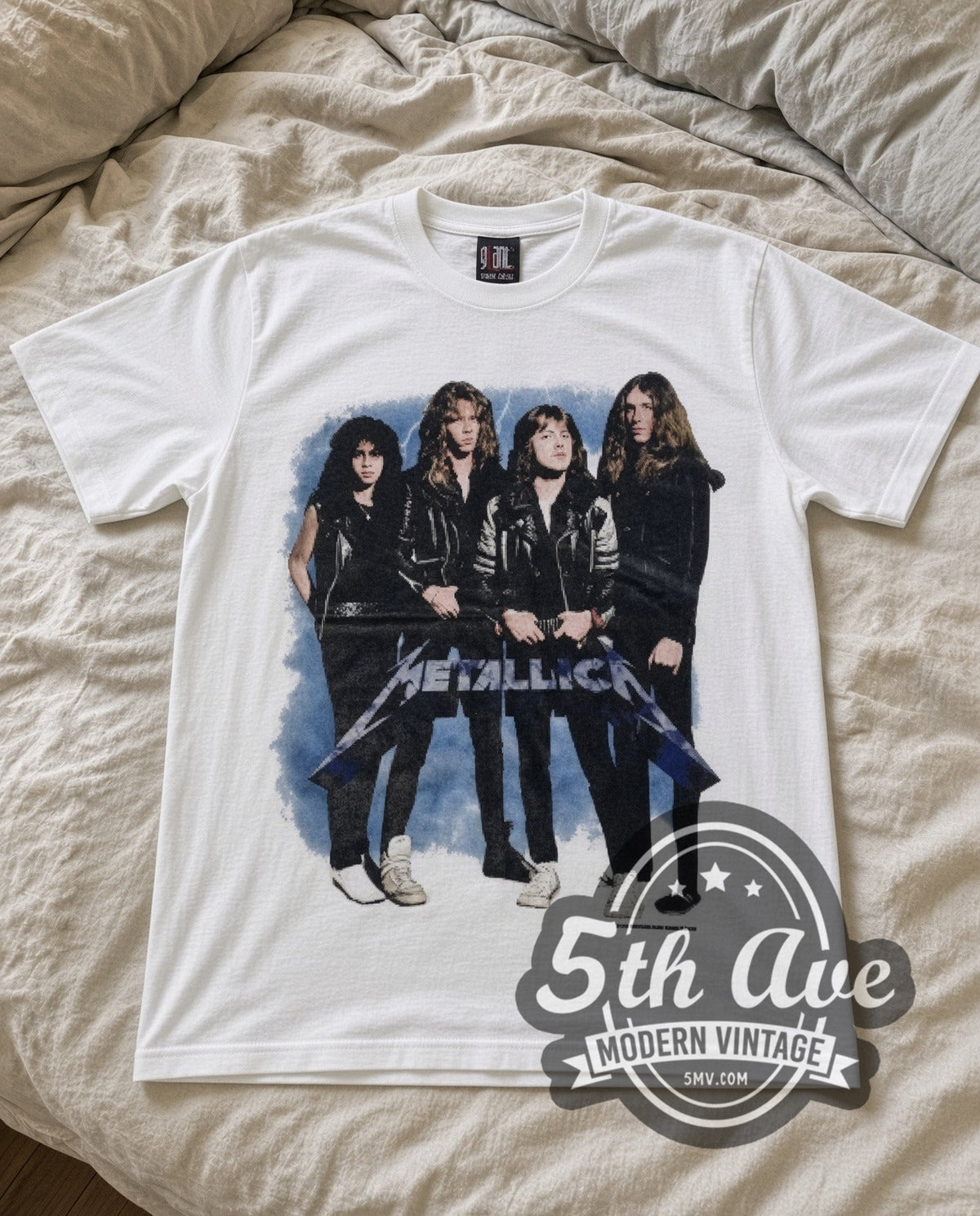 Metallica Group Photo vintage band t-shirt in white laid flat on a bed, front artwork