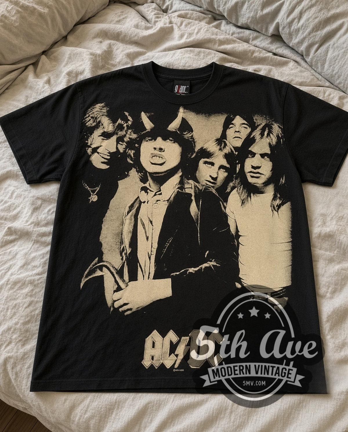 AC/DC Band Photo vintage band t-shirt laid flat on a bed, front artwork