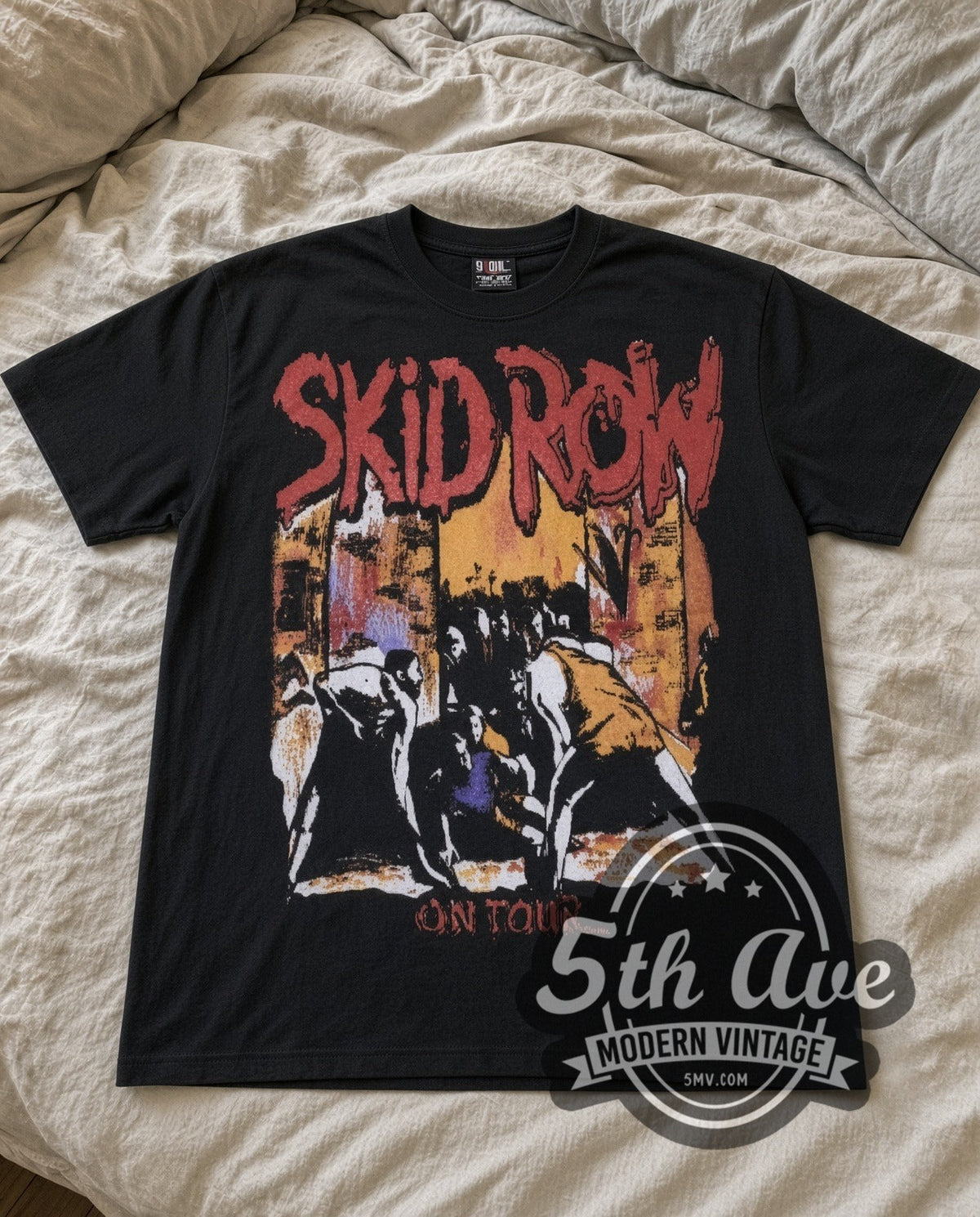 Skid Row On Tour vintage band t-shirt laid flat on a bed, front artwork