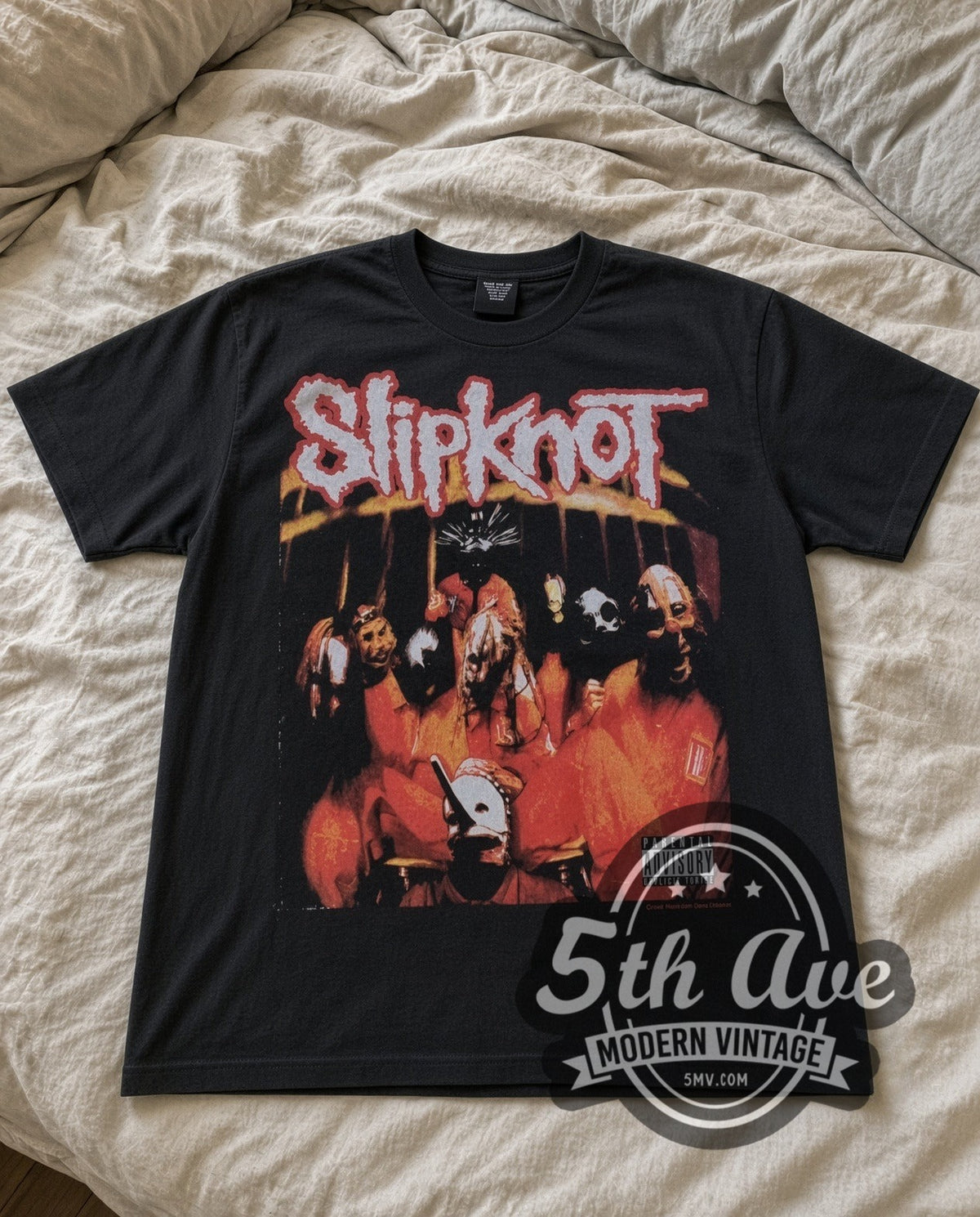 Slipknot Group Photo vintage band t-shirt in black laid flat on a bed, front artwork