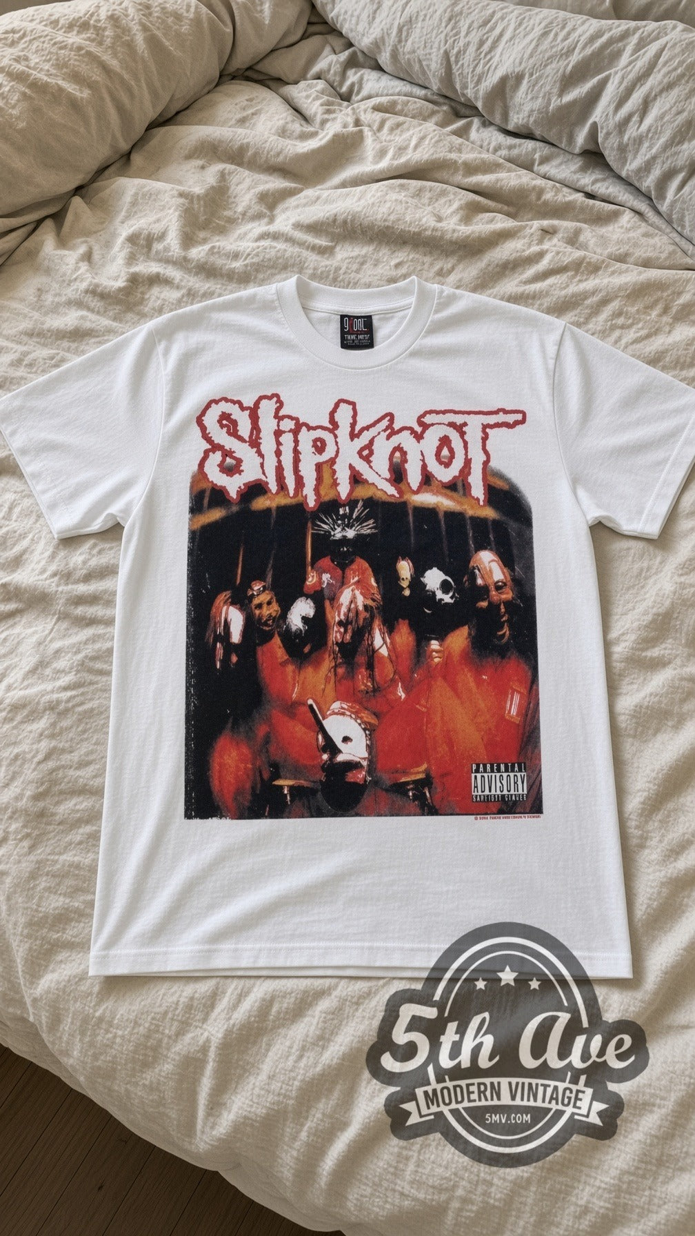 Slipknot Group Photo vintage band t-shirt in white laid flat on a bed, front artwork