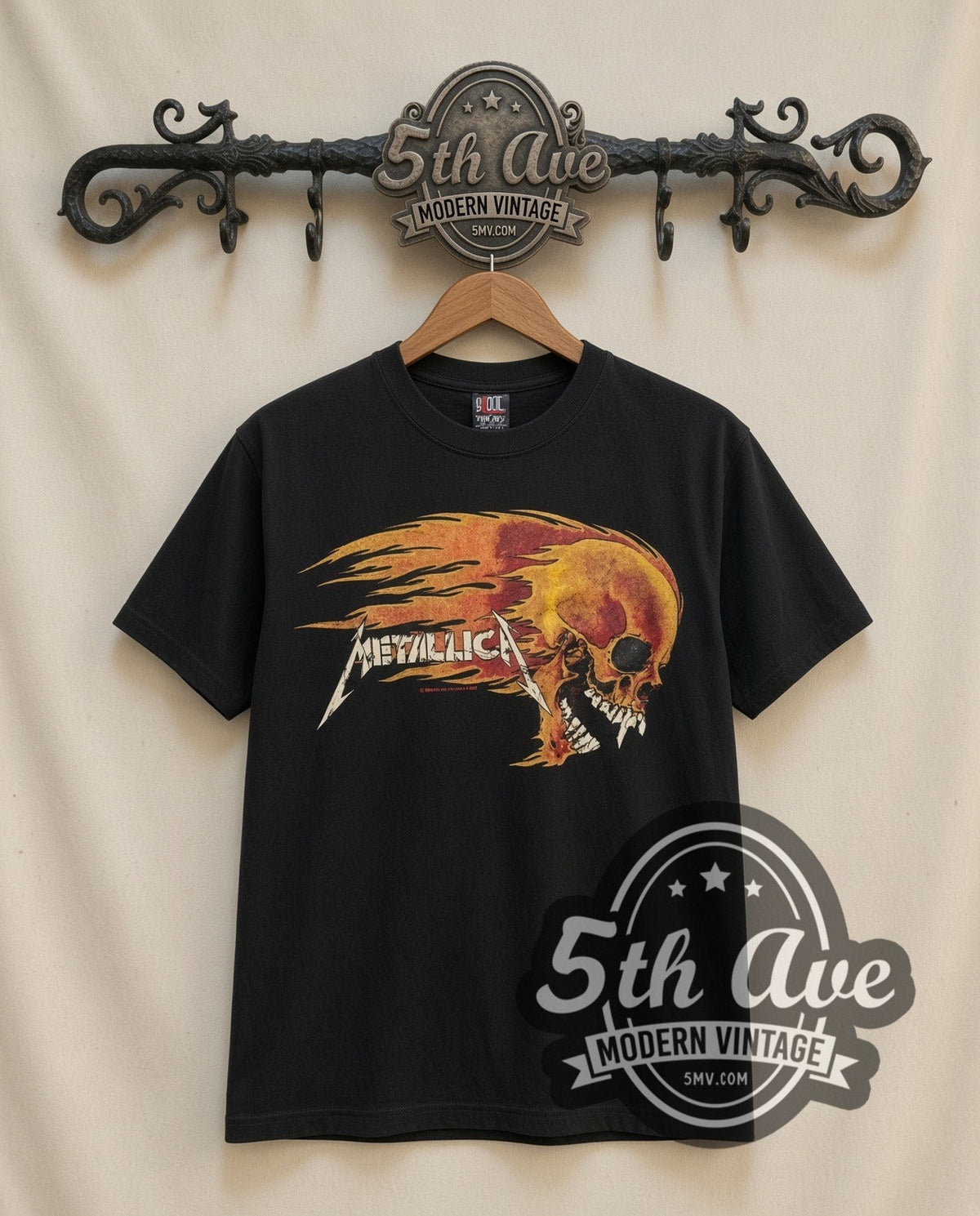 Metallica Flaming Skull vintage band t-shirt, front view on a display rack