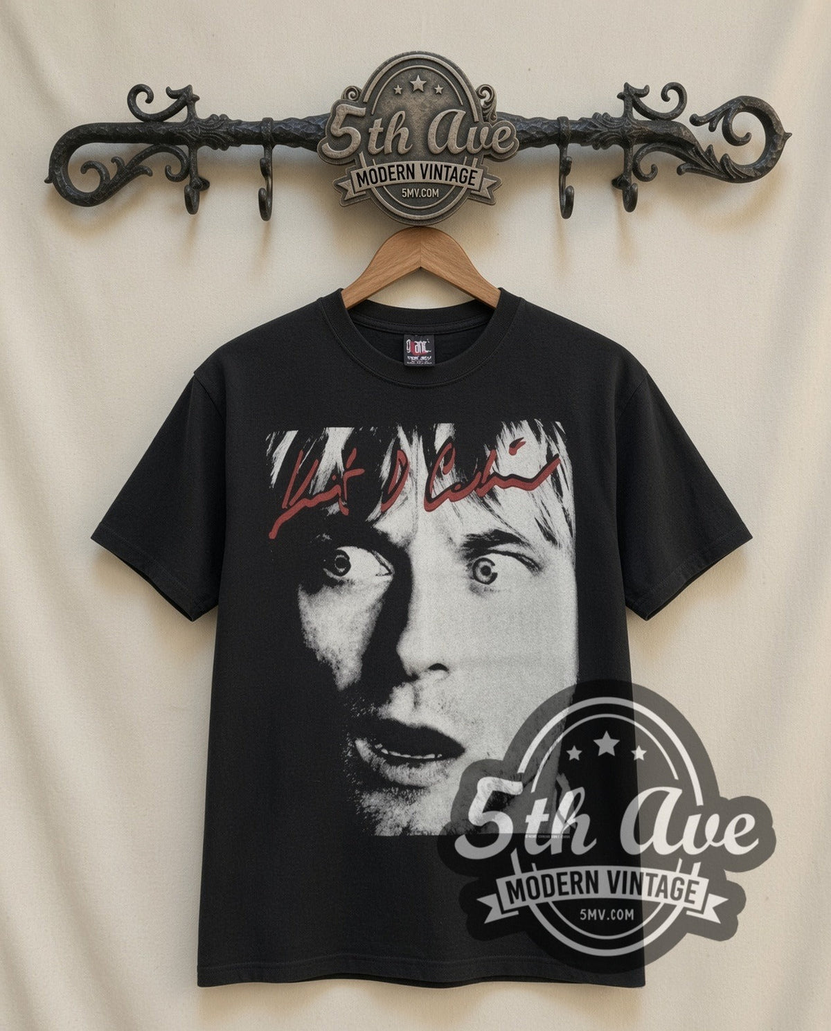 Kurt Cobain Wide Eyes vintage band t-shirt, front view on a display rack